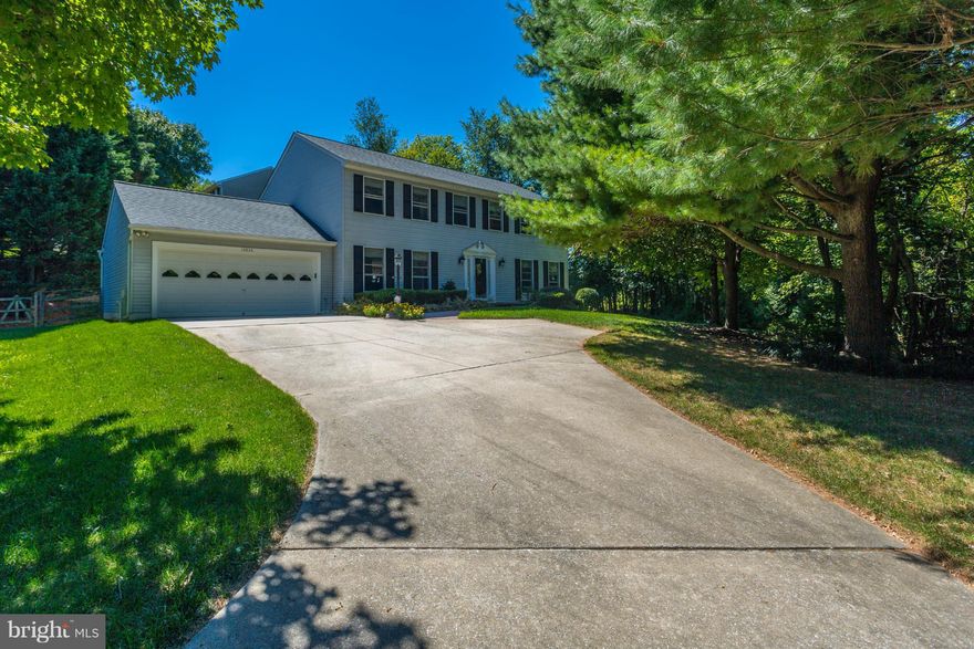 This 5 bedroom home is located at the end of a quiet cul-de-sac. Hardwood floors in the Kitchen, Living, Dining and Family Rooms. Kitchen features granite countertops and cherry cabinets. Upgraded trim work. Ceiling fans in all bedrooms. Master Bedroom suite with dressing area. Slider doors from the Family Room to a screened rear porch which looks out on a beautifully landscaped back yard.