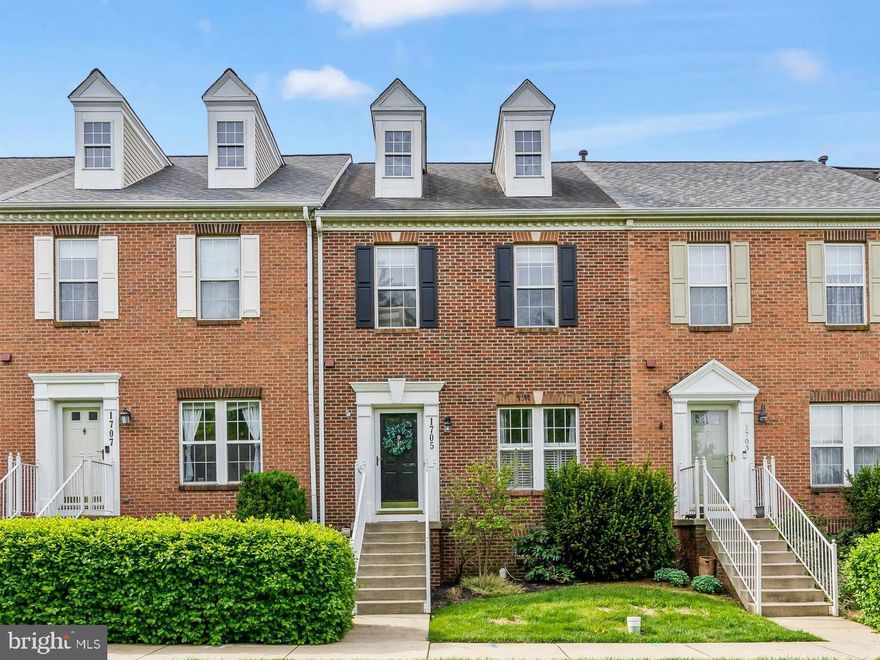 Welcome to this beautifully updated brick-front townhome in the sought-after Dearbought community!  Offering three bedrooms and three full bathrooms, this home features a thoughtfully designed layout ideal for modern living.  The main level is an open floor plan with living room, dining room, kitchen with white cabinets, farmhouse sink, stainless steel appliances and a convenient kitchen island.  The kitchen opens to a spacious bump out living space, with vaulted ceiling, and includes a feature board and batten wall. On the upper level, you'll find the primary bedroom with a walk-in closet and a private bathroom with walk in shower, along with 2 additional bedrooms and a full bath.  The basement is finished with a recreation room, full bathroom, laundry, storage and utility rooms.  And, don't miss the rear yard, featuring a deck with stairs down to your fully fenced rear yard including a patio, with two parking spaces just behind the fenced yard.  This is a perfect location to enjoy all the amenities of Dearbought including outdoor pool, walking trails, rec fields and tot-lots. All just moments from shopping, dining, and commuter routes. Schedule your showing Today! Professional photos coming soon.