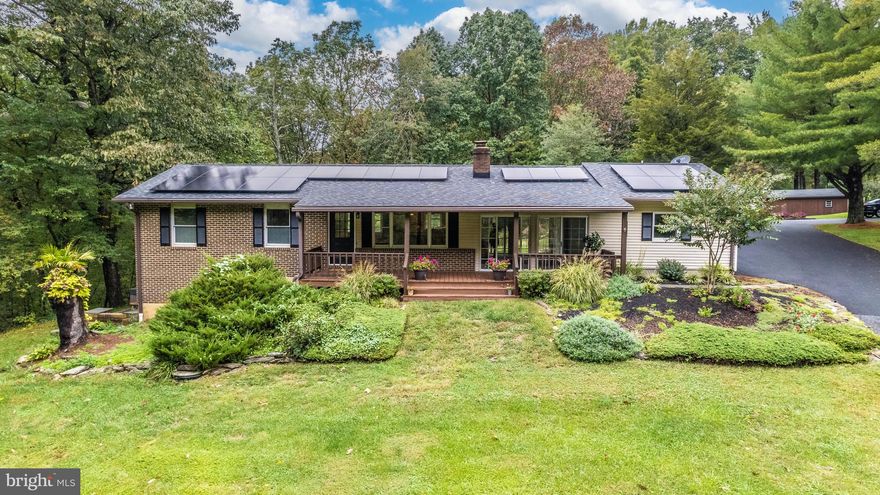 Welcome home! This truly gorgeous property sits on over two acres and features a tranquil garden filled with wildflowers. Stepping inside, you will notice the open concept dining and kitchen area, which boasts all stainless steel appliances and gorgeous light fixtures, as well as a pass through window to the living room. The living room is filled with abundant natural light from myriad floor to ceiling windows. The master bedroom, complete with wooden detailing on the windows and crown molding, features wooden floors and a walk-in closet. Two further bedrooms and a spacious bathroom with a his-and-hers vanity complete the upstairs. Downstairs, a roomy entertainment area awaits you, as well as another bedroom and a laundry space with ample storage. This home comes complete with a brand new hot tub and vegetable garden. Care about the environment? This home ALSO features an electric car charging port and brand new owned solar panels for extra electricity savings. Enjoy your privacy in this secluded neighborhood with no HOA. This home is a true find, and won't last long!!