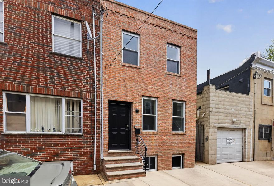 Welcome to your low-key South Philly dream. This isn’t a fixer-upper situation—it’s a done situation. Brand new roof, HVAC, plumbing, electrical, water heater, flooring, the whole deal. Everything’s permitted. Everything works. You can literally unpack your boxes and pour a drink.

The main floor is bright and open with a kitchen that doesn’t feel like a kitchen from 1987—granite counters, stainless steel appliances, modern gold hardware. It flows naturally into the living and dining area, which is clutch for actually using your space. Upstairs, you’ve got two solid bedrooms, a primary suite with its own bathroom, a second full bath (yes, TWO full baths—game changer), and laundry on the second floor. That’s the kind of everyday luxury that actually matters.

The backyard is yours—private, fenced, ready for whatever. Basement is clean and functional for storage. Smart home extras like a Nest thermostat and Ring doorbell because it’s 2026.

And the location? You’re tucked on a quiet residential block, but you’re minutes from everything: Passyunk Ave’s whole scene, the Bok Building (Irwin’s, Machine Shop, all the spots), public transit, Center City, the Sports Complex. Close enough to get in on the action, far enough to actually have peace and quiet.

This is the kind of home, at this price, at this location, doesn’t sit on the market long. It’s solid. It’s ready. Let’s get you in here.