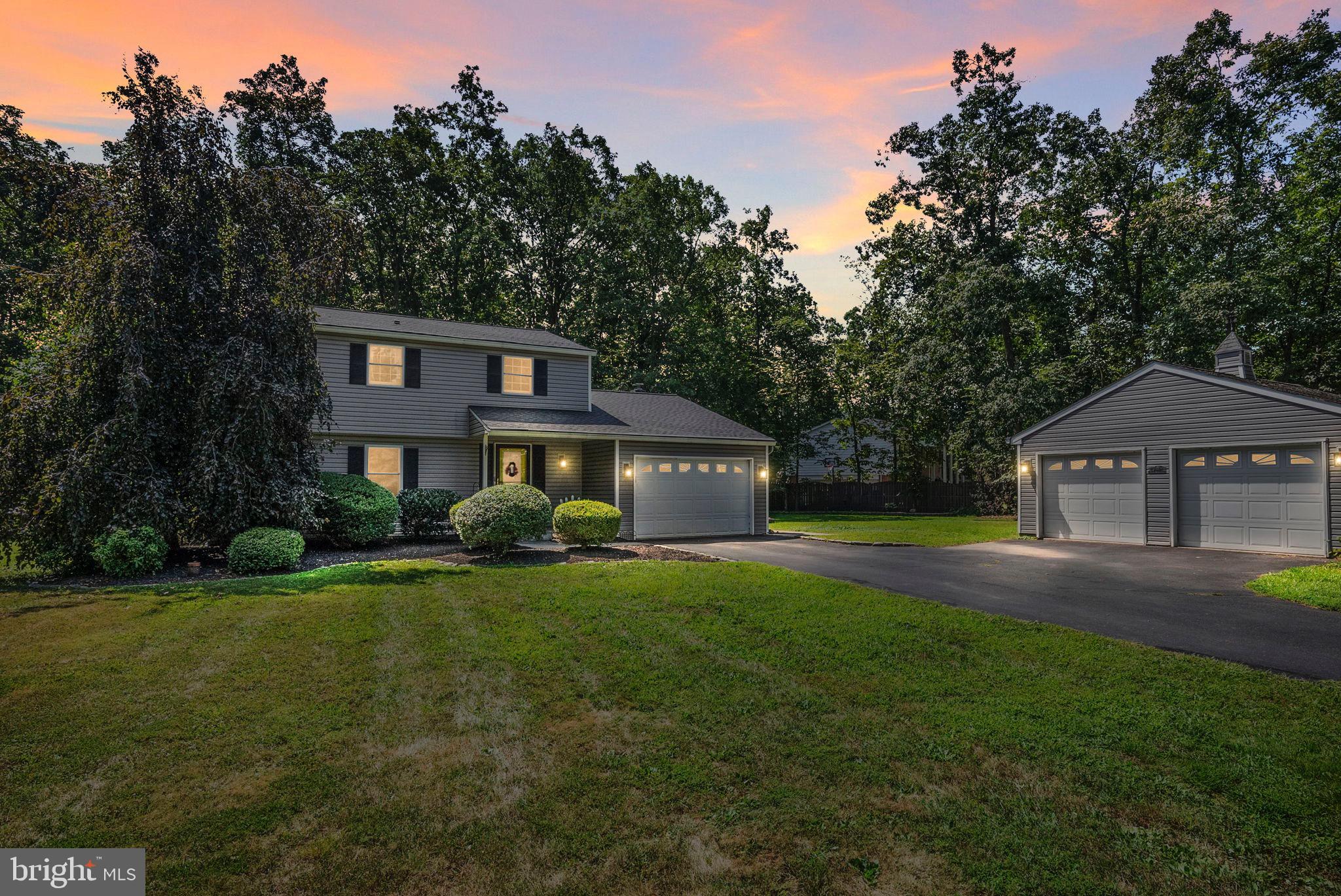 Nestled on a generous 1.07-acre corner lot, this exquisite traditional home exudes charm, sophistication and ample opportunity to enjoy the great outdoors. Built in 1983, the property showcases a well-maintained exterior with durable vinyl siding, harmonizing beautifully with the surrounding partly wooded landscape. The expansive yard offers a perfect blend of open space and natural beauty, ideal for outdoor gatherings or serene moments of reflection. As you approach, the inviting porch beckons you to relax and enjoy the tranquil views of the lush trees and woods that envelop the property. The outdoor features include a delightful play area complete with equipment, making it a perfect retreat for leisure and recreation. An additional detached garage provides ample storage and versatility for hobbies or projects. Inside, the home boasts 1,918 square feet of well-designed living space, featuring four spacious bedrooms and one and a half bathrooms. The cozy wood stove serves as a focal point in the living area beside the open kitchen, creating a warm ambiance for gatherings. The main floor laundry adds convenience to daily living. Located in a peaceful setting, this property offers the best of both worlds-seclusion and accessibility. Enjoy the serenity of country living while being just a short drive from local amenities, shopping, and dining options. This residence is a rare find, combining luxurious features with a picturesque setting, making it an ideal sanctuary for those seeking comfort and tranquility.