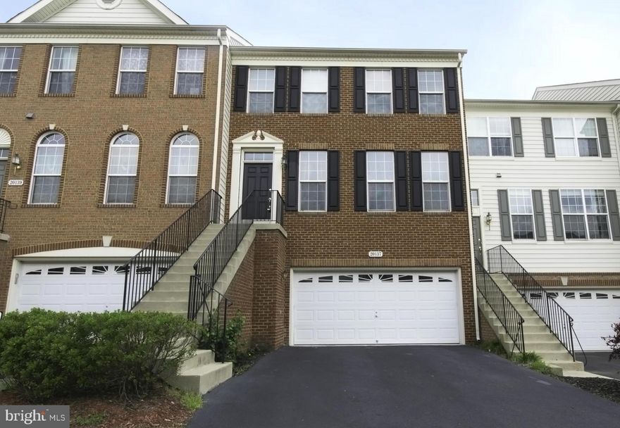 3BR Brick Front TH w 2 Car Gar in Belmont Country Club! Brand new carpets. Open Floor plan w 9'ceilings on main & lower levels, vaulted ceilings in all BRs.  Hardwd flrs; Granite in kit 1 yr old. Walk-in Bay in breakfast area. Fam Rm w Gas FP on main lev. MBR has 2 walk-in closets,sep shower/soaking tub.Laundry is on upper lev. Huge Rec Rm w French Dr w/o on lower lev. Premium lot backs to trees.