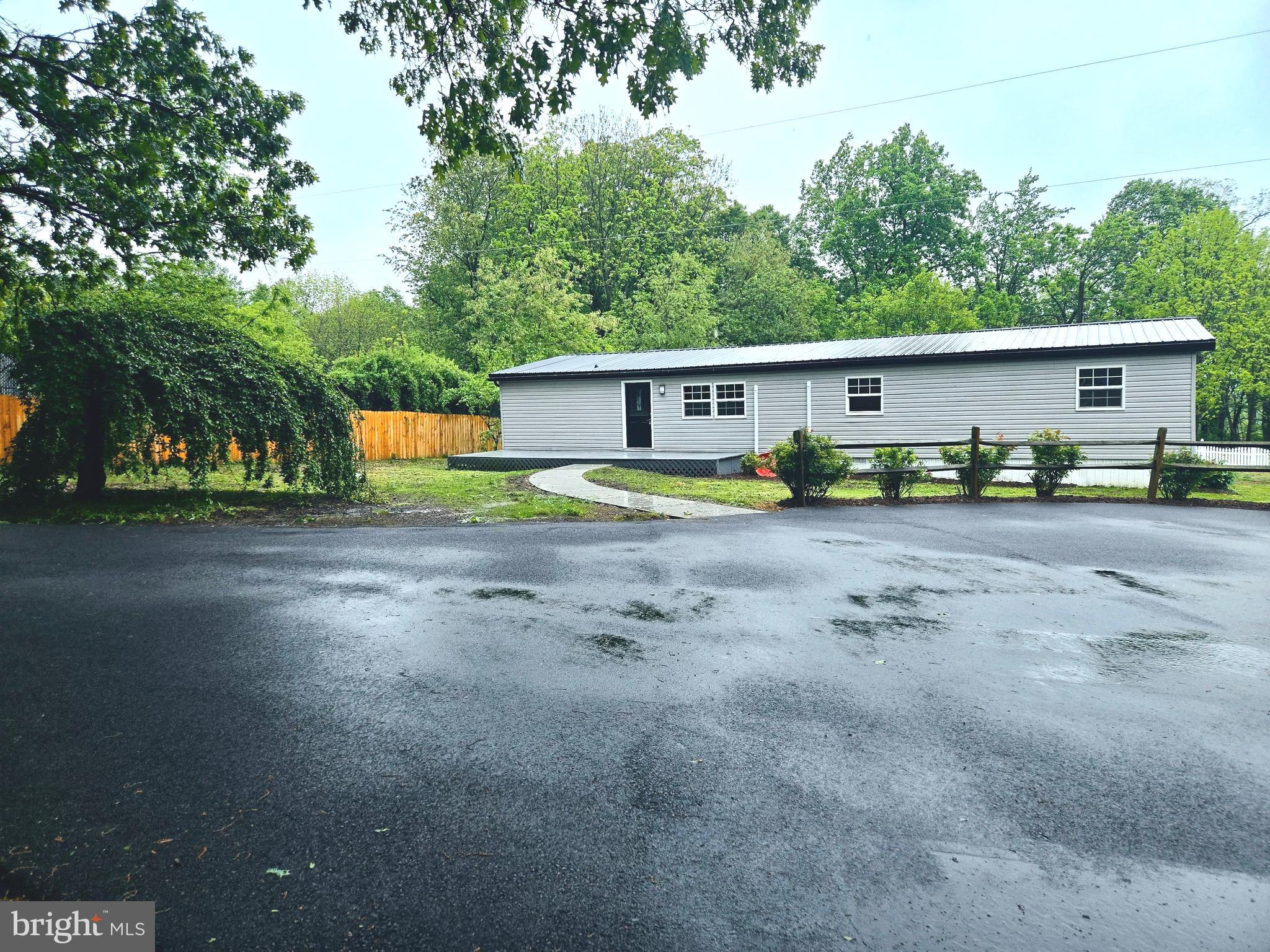 Located in beautiful Quarryville, this renovated 4-bedroom, 2-bathroom ranch style home is ready for new owners. Sitting on a half-acre, the property is ideal for family gatherings, gardening, and childrens play. The freshly asphalted driveway provides ample parking space, perfect for a camper, boat or RV.
The updated kitchen includes granite countertops, modern backsplash, new cabinets, water system, refrigerator, stove, microwave, fixtures and dishwasher. The bathrooms have new fixtures, vanities, and shower/tub enclosure. Each bedroom offers comfort, suitable for relaxation or a home office. Fresh paint and flooring throughout the home! The home includes both a front deck and a covered back deck ideal for relaxing outside regardless of the weather. Additional updates include beautiful new doors, 7 split duct systems, new rain gutters, new lanscape and hardscape and a new septic system. Fresh, clean and ready to move in. Book your tour today!