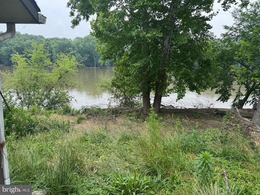 100 ft of frontage on the Potomac River is the focus here, but there's also a 2 bedroom, 12 x 55 mobile home, a 12 x 16 pavilion, a 12 x 12 free-standing deck and more! Private drilled well and septic system onsite!  Start your Summer now. Call today for a private showing. 

As you might expect (because it's fronting on the river), it's also in the 100-year floodplain - so this is a "cash-only" purchase.