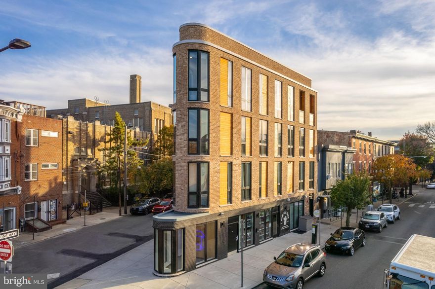You don’t want to miss the opportunity to acquire 715 E Passyunk Avenue, home to the distinguished Petit Coin. Completed in the fall of 2021, this remarkable development features two luxury residential units, each offering two bedrooms, as well as two expansive street-level commercial spaces encompassing over 1,450 square feet. The commercial corridor at Petit Coin is anchored by Ham & Bone, a specialty pet retail and grooming boutique. The property’s wedge-shaped design and distinctive facade add architectural variety and visual interest to one of Philadelphia’s most historic and affluent subdivisions.
Petit Coin, translating to "little corner," perfectly encapsulates the charm of this triangular development, which is situated at one of the most prominent intersections in Queen Village, at the corner of 5th and Passyunk. Queen Village, one of Philadelphia’s oldest residential neighborhoods, thrives today with a vibrant mix of eclectic restaurants and small businesses. Featuring premium finishes and sophisticated design elements, Petit Coin stands out as a one-of-a-kind property. This development offers investors a rare opportunity to secure a property with significant rental upside and no capital improvements required. Please note that taxes and square footage should be independently verified by the buyer.