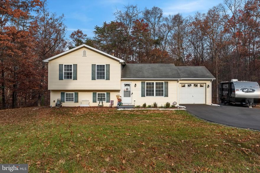 Nestled in a quiet neighborhood, this captivating tri-level house boasts a perfect blend of modern comfort and timeless charm. With three bedrooms and two bathrooms, this home provides ample space for both privacy and togetherness. The convenience of a one-car attached garage is complemented by additional parking space beside it, accommodating not only your everyday needs but also the adventurous spirit with room for a camper. The recently paved driveway adds a touch of luxury, while the backyard deck offers a serene retreat for outdoor gatherings. Inside, the home is a showcase of thoughtful upgrades, featuring a fully remodeled interior just two years ago. The kitchen is adorned with newer appliances, HVAC system and water heater, ensuring efficiency and comfort year-round. With its combination of practicality and elegance, this residence is a haven for those seeking a harmonious blend of modern living and classic appeal.