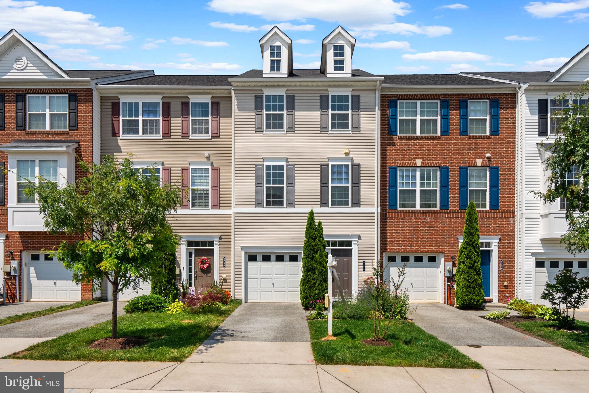 Welcome home! This turn-key townhome features smart upgrades, including bump outs and Cat6 fiberoptic wiring on each of the 3 levels, providing tech-infused additional space for work or play. Tall ceilings, large windows, and hand-scraped hardwood floors create a warm, inviting space filled with natural light. The gourmet kitchen shines with a huge island, stainless steel appliances and extra space for dining —perfect for entertaining. Enjoy flexible living with a light filled sunroom, a bright half bath, and composite deck overlooking nature.
Upstairs, the spacious primary suite includes a large sitting room perfect for winding down at the end of the day. The luxurious ensuite bath with tiled walk-in shower, double vanity, and custom ELFA shelving in the walk-in closet finish off the primary suite. Two more large bedrooms, a full bath, and laundry complete the level.
The lower level offers a huge rec room with bonus finished space, half bath, and walk-out access to the backyard. This space is perfect for a game room, theater, or guest space. Large closets and the 1-car garage with shelving provide tons of extra storage. Close to Fort Meade, High Ridge Park, lots of nature trails and major commuter routes, this home blends luxury and convenience. Welcome home!