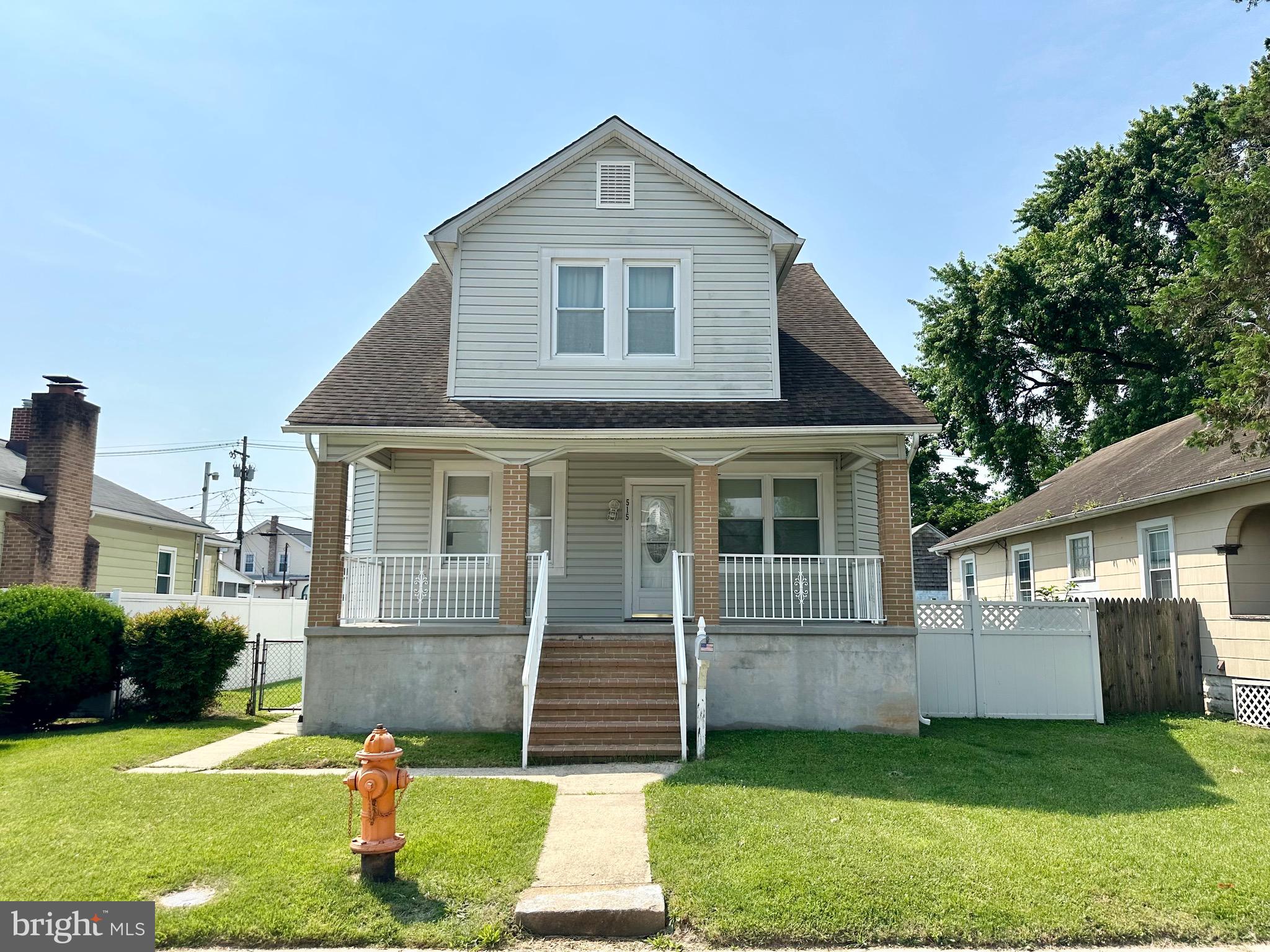 This well-maintained bungalow offers two separate living spaces, perfect for an owner-occupant with rental income potential or a savvy investor. The main-level unit features 2 bedrooms and 1 full bath with beautiful hardwood floors throughout the living room, dining room, hallway, and bedrooms. The spacious kitchen includes tile flooring, stainless steel appliances, and ample space for a dining table. The upper-level apartment, also offering 2 bedrooms and 1 full bath, was updated in 2023 with a new HVAC unit, new LVT flooring, and fresh paint throughout. The modern kitchen features stainless steel appliances and access to a private balcony overlooking the large, fenced-in backyard with a vinyl privacy fence—ideal for outdoor enjoyment. Additional highlights include a shared laundry area in the basement, as well as private storage closets for each unit. This versatile property is a fantastic opportunity with tons of potential! Photos of upper level apartment are from before it was rented. Upper level is currently rented for $980.00 a month.