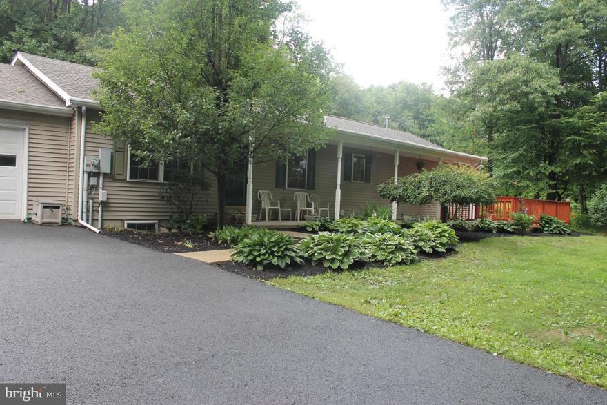 Fantastic home on top of the mountain. 4 bdrms, one would make a great office. Large kitchen with island, jenn air range, pantry & plenty of cabinets & counter space. LR with propane fireplace. Bsmt finished into 2 bdrms, office & huge great room (need flooring & ceiling to be completed. 8.6 acres of mostly wooded & some open area. Large front porch & two decks to watch the turkey & deer. Master/W/I closet, tub/jets, double vaniity & stall shower