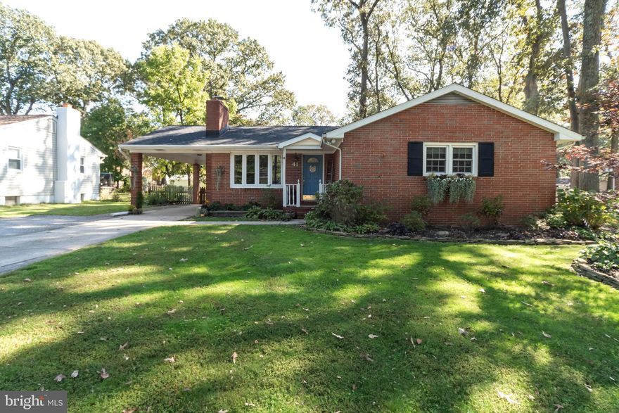 What an opportunity to jump on this amazingly  beautiful rancher in the water privileged community  of Magothy Forge.  Located off the Magothy river, this home is just blocks from the water. So, bring your boat, jet skis and kayaks and start your next chapter in this beautiful home and enjoy the benefits of being so close to the water.   This brick rancher offers 3 bedrooms, 2.5 bath, beautiful hardwood floors, a wood burning fireplace, an awesome master suite with full bath, a large and open finished lower level with pellet stove, a lower level office, an expansive patio leading to the well manicured backyard and a single carport.   The home includes many  recent updates including a new roof in 2020,  new heat pump in 2016, Quadra-fire pellet stove in 2018, replaced slider off dining room in 2015 and new fridge in 2018. This place is ready for its new owners.