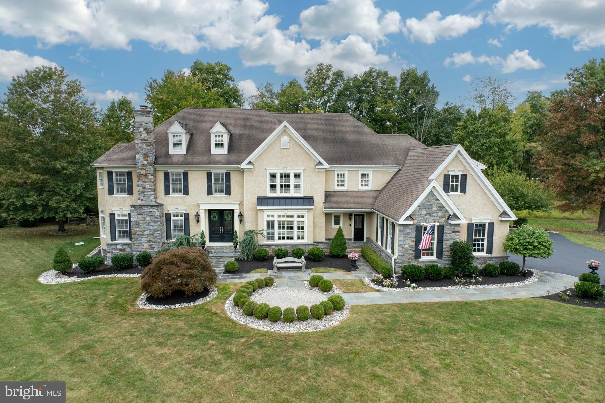 Introducing 1736 Chantilly Lane, nestled amongst the pastoral rolling hills in the idyllic neighborhood of Chantilly Farm, a premiere enclave of 34 luxurious estate homes. This exquisite CUSTOM home is set at the end of a quiet cul-de-sac, featured on a private, professionally landscaped 1 acre lot. This home will enthrall any buyer seeking an unparalleled Chester Springs location. The exceptional curbside presence sets the stage for elegance and luxury throughout, while maintaining an atmosphere of comfort and tranquility. Elegant doors welcome you into a stunning front to back foyer, with a formal living room with fireplace to your left, and a spacious dining room with a large window seat to the right. Off the living room, French doors lead you to a handsome study with a plethora of natural light. A charming butler’s pantry allows entertaining to flow seamlessly from the dining room into the kitchen. The gourmet chef’s kitchen is complete with radiant in-floor heating, custom cabinetry, custom arched doorways and a sizable walk-in pantry. This breathtaking kitchen is an entertainer's dream! Outfitted for the most discerning chef, the massive island is flanked with beautiful granite countertops. The appliances have been upgraded including new dishwasher (2019), new microwave (2020), new kitchen faucet in (2022) and new double oven (2024). The adjoining breakfast room offers ample natural light and room for an oversized dining table. Step down into the impressive family room with fireplace and gorgeous coffered ceilings, overlooking the expansive, 3 tired maintenance free deck with gazebo. This gorgeous outside retreat offers 2 retractable awnings and an under-ground irrigation system, which completes the exterior of this manicured and well lit yard. And yes, there is room for a pool! A large mudroom with custom cabinetry offers 2 entrances into the home, off the front and the garage. A second staircase is conveniently situated to take you to the upper level, where you are welcomed to the elegant and inviting primary suite, with custom plantation shutters, tray ceilings and a spacious custom walk-in closet. The sumptuous primary bath is meant for pure serenity, with a soaking tub and large shower with built-in bench and glass door. This level also boasts 4 additional oversized bedrooms, complete with en suite bathrooms and one with a Jack and Jill bath. The laundry room completes this floor with an abundance of counter space and cabinets. There is nothing left to the imagination when entering the fully finished walk-out lower level! The main area features an expansive lounge area, with custom built-in cabinetry, adjacent to another open area for games and entertaining. A separate home gym allows for an enjoyable work-out any time of the day! BUT…. the PIECE de RESISTANCE….the opulent STATE OF THE ART IN-HOME THEATER, with 12 theater grade reclining chairs, complete with ticket booth, professional pop-corn machine and concession stand, is unparalleled! You are instantly transformed to the grande old days at the theater! There is even a marquee to showcase the latest movies! A fully equipped kitchenette with new refrigerator and large island completes this space. Built by renowned Moser Homes, this meticulously maintained home has over $400K of upgrades from previous owners. The 4 car garage with custom built-in cabinetry is complete with a PET WASHING STATION. FULL HOUSE GENERATOR, California plantation shutters throughout, new septic (2016), two new HVACS (2018), the list goes on and on-this home has it all. Situated in the award winning Downingtown EAST SD, and acclaimed STEM Academy, as well as neighboring Montgomery School. Minutes from all major roads, including PA Turnpike, Rt 30 and Rt 202 for easy commuting. Convenient to wonderful restaurants, markets and retail shopping nearby. Don't miss this opportunity to experience living in the highly desirable and much sought after Chantilly Farm!