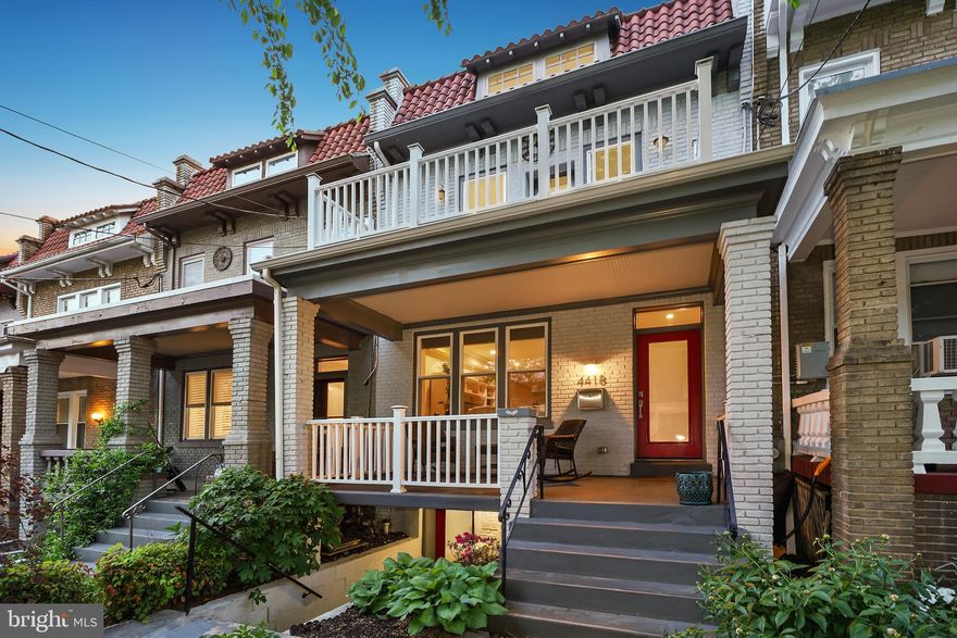 Welcome to 4418 New Hampshire Ave NW — where classic DC architecture meets modern comfort in the heart of Petworth. This beautifully updated brick rowhome, originally built in 1924, has been thoughtfully reimagined for contemporary living while preserving its original charm. With four bedrooms, three and a half bathrooms, and secure parking for two cars, this home offers a perfect blend of style, space, and location.
A lovely front porch and timeless stone hardscaping invite you inside to a light-filled main level featuring an open layout ideal for both entertaining and everyday living. The spacious living room, accented with crown molding, recessed lighting, and warm wood floors flows through the dining area to a bright, modern kitchen - the heart of the home!  Which enjoys solid surface counters, stainless steel appliances, gas cooking, pendant lighting, and ample cabinetry.  Step right out to the rear deck, seamlessly connecting indoor and outdoor spaces. A stylish powder room rounds out the main level.

Upstairs, you'll find three bedrooms, two renovated full baths, and a conveniently located laundry area. The sunny primary suite includes recessed lighting, a walk-in closet, and sleek en-suite bath with a floating double vanity and glass-enclosed shower clad in elongated subway tile. One of the secondary bedrooms offers access to a charming front balcony — a perfect perch for relaxing.
The lower level provides a flexible bonus space with both front and rear entrances — ideal as a guest suite, home office, or potential rental. This level features a living area with tile flooring, a mini kitchenette, a bedroom, a full bathroom, and a second laundry area.

Enjoy outdoor living on the rear deck, front porch, and balcony — plus the convenience of secure off-street parking behind a roll-up garage door.

Located just moments from all that Petworth has to offer — including local markets, cafes, restaurants, libraries, and parks — this home is also less than a mile to both the Green and Red Line Metro stations. Whether you're strolling to the farmers market, grabbing a bite on Upshur Street, or commuting downtown, this location offers exceptional access to the best of DC living.