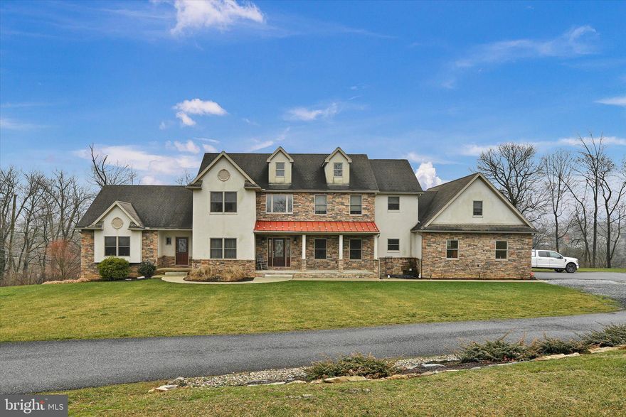 Welcome to 400 W Lawn Ave located in the sought after Wilson School District. This custom-built masterpiece spares no detail and spans over 4100 square feet on 5.19 acres of prime real estate with convenient access to Routes 422 and 222. Enjoy a lifestyle of comfort, sophistication and luxurious living.
 Efficiency takes center stage with a range of eco-friendly features, including a rain collection system, solar panels, and a cutting-edge 14-zone radiant floor gas heating system. The property boasts three A/C zones, an outdoor wood boiler, and a central vacuum system for ultimate convenience. The thoughtfully designed rain collection system ensures sustainability, while programmable electric switches enhance energy efficiency, this home sets the standard for modern living.  This residence is more than just a home; it's a retreat within itself. An in-law suite with a private entrance awaits, offering hardwood floors, a spacious living room, full bathroom, walk-in closet, private deck, and self-sufficient heating, cooling, and electric systems.  The heart of the main house is a kitchen to envy, featuring granite countertops, a large kitchen island, custom cherry cabinets, and top-of-the-line appliances including a double drawer dishwasher, dual fridge, and a 5-burner gas stove with a pot filler. The living room exudes comfort with a stone gas fireplace and abundant natural light through ample windows.  Entertain in style in the dining room adorned with hardwood floors, crown molding, and recessed lighting. Ascend to the second floor featuring three bedrooms, including a primary bedroom suite. Two bedrooms share a well-appointed hallway bathroom. The primary suite is a retreat in itself, featuring a massive walk-in closet with custom cabinetry and dressing area. The spa-like setting includes a separate whirlpool/soaking tub, glass walk-in shower, double sinks, and a 400+ square foot bonus room—an ideal space for an office, exercise room, or personal sanctuary.  Storage is abundant throughout, and the full basement with high ceilings and ample space is a blank canvas awaiting your creative touch. The property includes a generous 3-car garage with abundant space for cars and toys, and there's potential to build an additional garage if desired.  Don't miss the opportunity to inquire about the very low-interest assumable mortgage for a portion of the existing mortgage, making this dream home even more attainable. Welcome to a life of luxury, efficiency, and comfort at 400 W Lawn Ave.