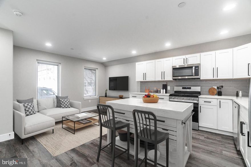 Welcome home! This 1000+ sqft bi-level apartment is only 2 years old, is pet friendly, and offers 2 bedrooms, 2 full bathrooms, large private backyard, and massive shared roof deck! Conveniently located just around the corner from all the fun on Frankford Ave, a block to the subway, the location can’t be beat! This spacious unit with great ceiling height throughout offers a ton of natural light, recessed lighting, great closet space, central air, and stylish finishes throughout. The first floor includes an open concept living/dining/kitchen area, one bedroom, full bathroom, and spacious backyard… a rare find in a Fishtown apartment and the perfect space for dining al fresco, gardening, entertaining, or working from home! The kitchen features quartz counters, stainless appliances, gas cooking, and ample closet space. The bathroom has quartz counters, matte black fixtures, and subway tiled tub/shower combination. The bedroom is spacious, has great closet space, and overlooks your private backyard. Downstairs you’ll find a second bedroom (or den if you’d like), full tiled bathroom with stall shower, washer/dryer, and amazing closet space. Upstairs you’ll find a huge 1500sqft roof deck to take in beautiful city views and holiday fireworks. This stunning apartment building is in the heart of one of Philly’s most desirable neighborhoods, Fishtown. Don’t miss out on the opportunity to live in a beautiful and spacious apartment in a premier location. This unbeatable location puts you just steps away from public transportation, restaurants, coffee shops, gyms, parks, galleries, vibrant nightlife, and more! Pets welcomed once approved by landlord, pet fees apply. Available Jan 1, 2025… schedule your showing today!!!! (some photos are virtually staged)