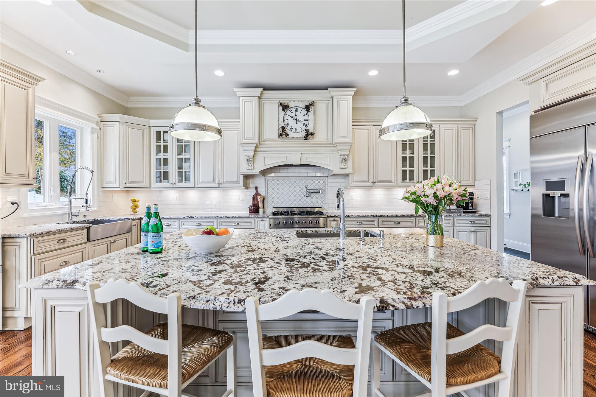 *Don't miss this *SPECTACULAR* 8 BR/5.5BA craftsman, just a few blocks from the center of McLean! Boasting approx. 8100 finished square feet, this finely detailed and expansive home features 3 finished levels of naturally bright open floor plan design with 10 ft. ceilings and a beautiful 2-story foyer. The main level includes beautiful hardwood flooring throughout; the formal dining room and light-filled living room are just off the entry foyer. Continue to the heart of the home with a spacious family room featuring gas fireplace, coffered ceiling and a wall of windows allowing amazing light through the day. The gourmet kitchen is a chef’s delight, highlighting high-end appliances, an oversized island with sink and bar area, granite countertops, additional farmhouse sink, and custom cabinetry. A butler’s pantry with a wine refrigerator adds convenience to your culinary experience. The breakfast area is open to the kitchen and family room, with access to the rear deck area overlooking the private backyard. Additionally, there is a guest suite/office with built-ins on the main level, providing convenience and flexibility. Completing the main level, next to the kitchen, find a convenient mud room area with built-ins and 2 large walk-in pantries. Step from the mudroom to 2 separate garages - one with single parking space and EV charging station and the second, with 2 parking spaces - both with ample storage space. On the upper level, the sprawling owner’s suite steals the spotlight, complete with a gas fireplace, sitting area with built-ins, separate room with large dressing area and 2 huge walk-in closets. The luxurious en suite features a stand-alone clawfoot cast-iron bathtub, spa-like walk-in shower, and two separate vanities. The large hallway with 4 additional generously-sized bedrooms include two big jack-and-jill bathrooms - both with dual vanities. Laundry is also located on this level with cabinets, sink, and countertop space. The lower level adds to the allure of this inviting residence with a spacious recreation room, wet bar, media room, exercise room and 2 additional spacious bedrooms – one with built-ins and en suite with soaking tub. Outside, a gorgeous stone-walled walk-up leads to the level backyard. EXCELLENT location in the heart of McLean - walk to grocery store, restaurants, schools! Franklin Sherman, Longfellow, McLean schools!