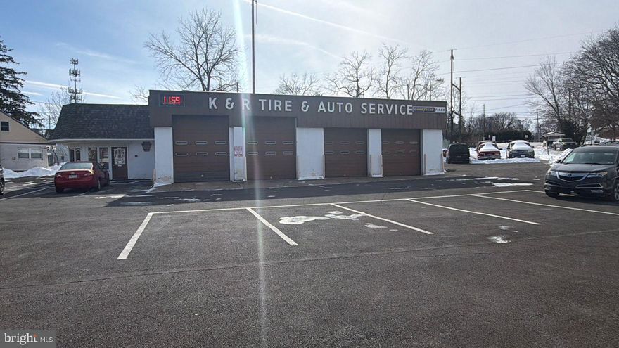 Located at 2926 Mount Carmel Avenue, this corner automotive repair shop offers unbeatable visibility in Glenside. With four double-length bays—two with convenient drive-through access—the shop is fully equipped for efficient service. Ample parking for 20+ vehicles ensures customer convenience. A separate 30x30 building offers potential for stackable lifts, expanding possibilities. The heated, central-air bays keep operations comfortable year-round. Inside, you’ll find a welcoming waiting room, two office areas, and dedicated owner storage. Family-owned for 25 years, both the business and property are offered together. With long-standing name recognition, high traffic exposure, and room to grow, this is a rare owner-user opportunity.