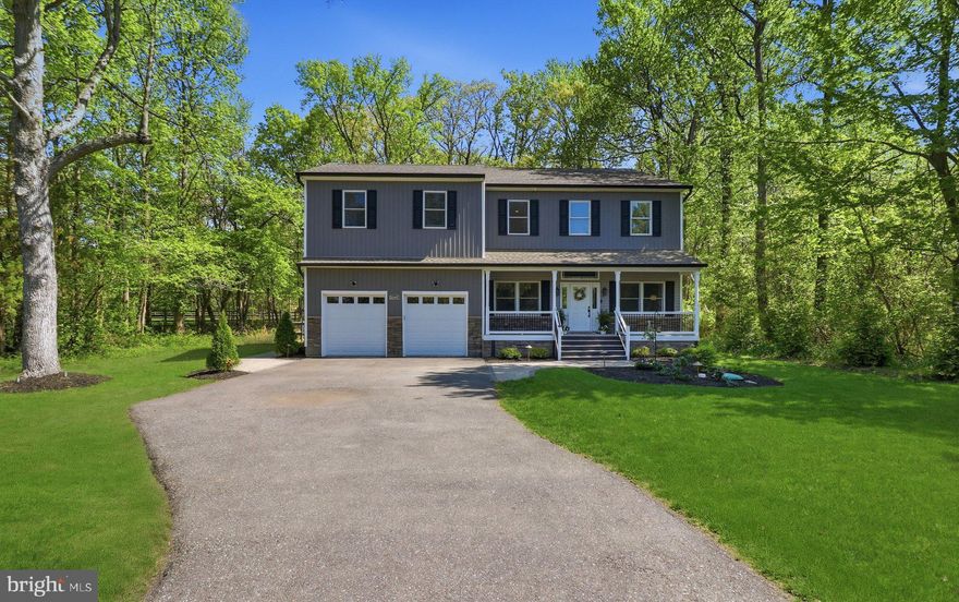 Built in 2022 and already improved in all the right ways. 5-bedroom layout with a clean, open main level that shows well and lives even better. Fresh paint throughout and custom closet systems in every bedroom. 

Kitchen is beautiful: large island, granite, Samsung stainless, tile backsplash, and plenty of cabinet space. Opens directly to the living/dining area with 10’ ceilings, hardwoods, and good natural light. French doors lead out back to a deck and new paver walkway—done right and actually usable for entertaining.

Primary suite has been upgraded with a fully redone bath—floor-to-ceiling tile, double vanity, glass walk-in shower. Secondary bedrooms are all well-sized (no throwaway rooms), each with ceiling fans. Laundry upstairs where it should be. 

Extras include sprinkler system, security system, CO/fire detection, generator hookup, Anderson windows, and architectural shingles. No HOA and ONLY 2 minutes to the water!!

Newer construction with thoughtful upgrades already completed and a layout that makes sense. All you'll have to do is move right in.