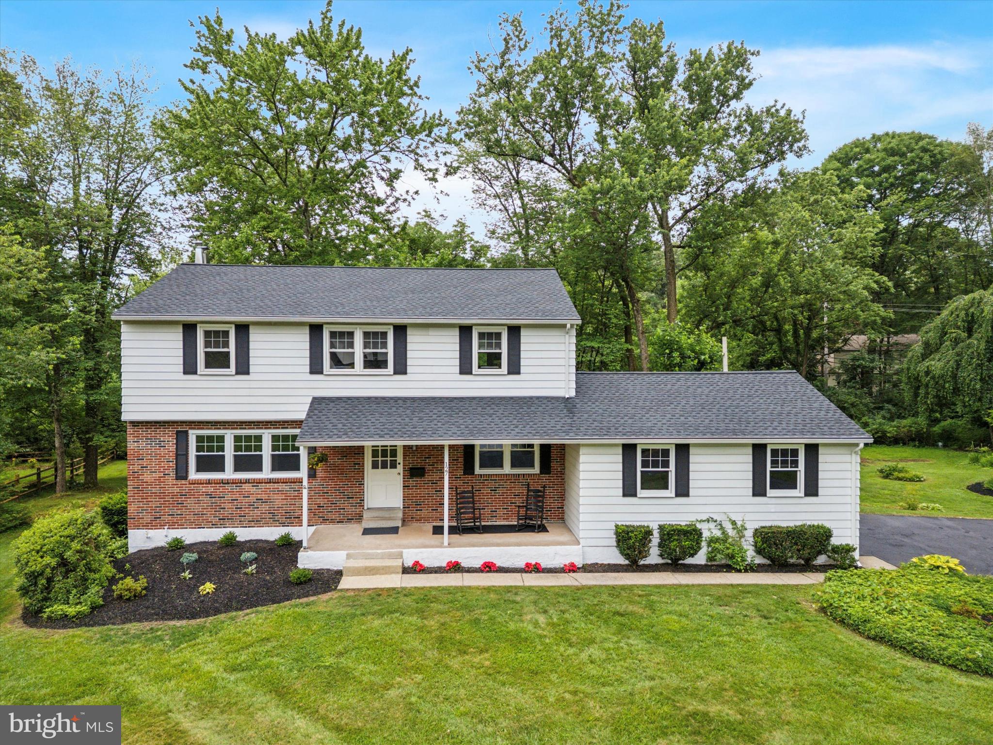 Welcome to this stunning, completely updated 4-bedroom, 2.5-bathroom colonial nestled on a beautifully landscaped, oversized lot. From the moment you step inside, you’ll be greeted by gleaming hardwood floors that flow seamlessly throughout the home, setting the tone for timeless elegance and modern comfort. The heart of the home is the bright and stylish kitchen, featuring crisp white cabinetry, sleek quartz countertops, and stainless steel appliances—perfect for both everyday living and entertaining. The adjacent dining and living areas offer a warm and inviting space to gather with family and friends. Upstairs, you’ll find four spacious bedrooms and tastefully renovated bathrooms, showcasing tile floors, granite countertops, tiled showers, and contemporary cabinetry that blend both function and flair. The large basement provides ample room for all your storage needs or future expansion potential. Outside, enjoy the privacy and tranquility of mature landscaping that surrounds the home, creating a picturesque setting in a sought-after neighborhood.
Don’t miss this move-in ready gem where modern updates meet classic colonial charm!