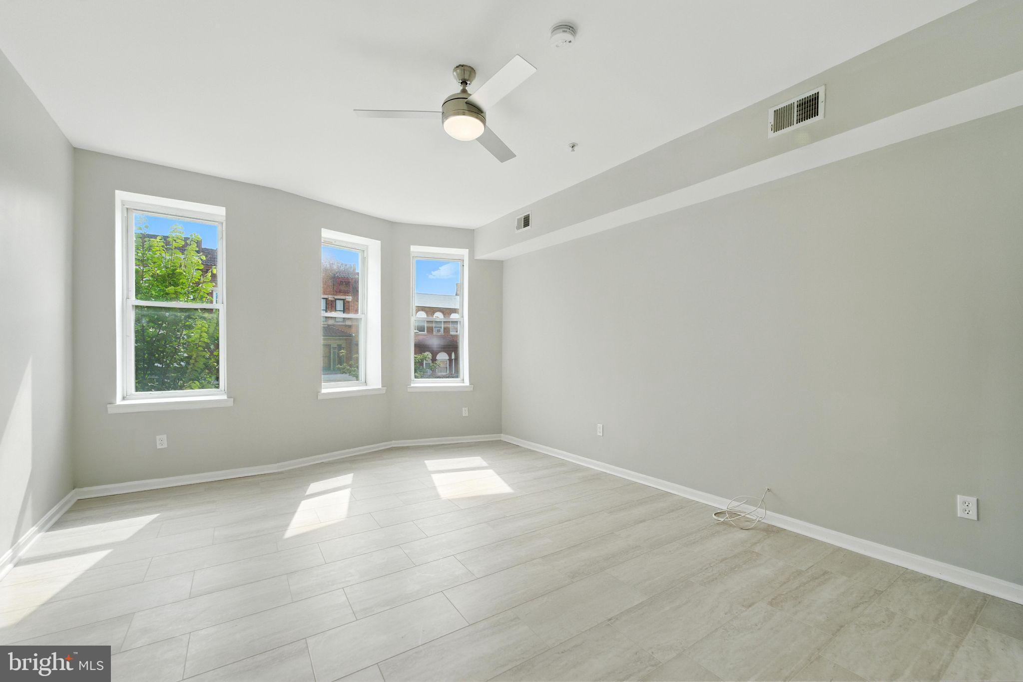 Open Sunday 1-4PM! Step into style and comfort at 2100 Homewood Ave #2—a newly renovated top-floor 3-bedroom, 1-bath unit nestled in the revitalizing Midway neighborhood. This sun drenched apartment features luxury vinyl plank flooring throughout and a stunning skylight that fills the living area with natural light. Step out onto your private balcony, where you can enjoy views overlooking the park setting behind the property—perfect for morning coffee or unwinding after a long day.
Located just minutes from Johns Hopkins University, Penn Station, and Downtown Baltimore, this home offers unbeatable access to bus lines and MARC Train service—ideal for commuters and city explorers. Explore the nearby Charles Village district, filled with eclectic restaurants, cafés, and local shops. Enjoy outdoor activities at Druid Hill Park, Clifton Park, and Wyman Park Dell—all within easy reach.