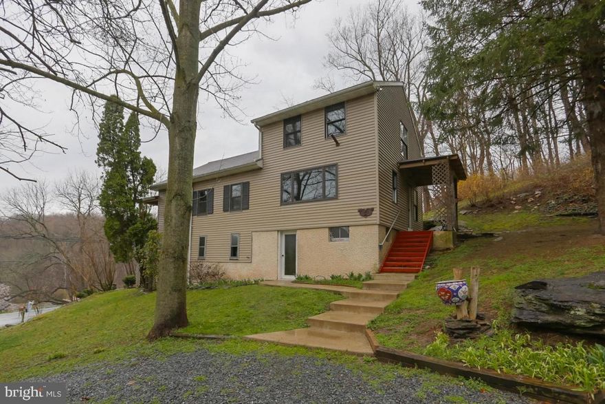 3 bedroom home in Penn Manor schools oh 1.89 acres. Kitchen with dining area and electric flat top stove, wood stove in finished walk out lower level and 2 car garage. Covered deck, side porch leads to spacious yard.