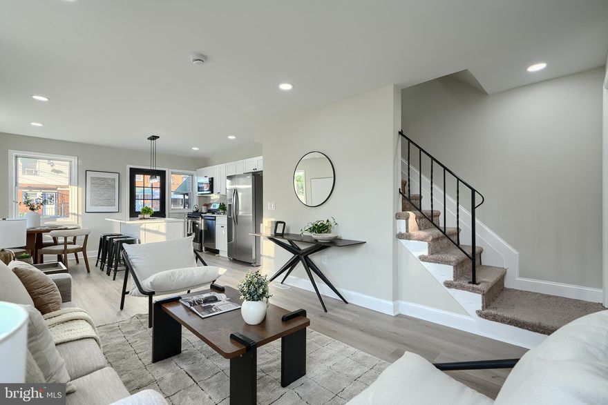 Welcome to a sun-drenched beautiful renovation in the Cherry Hill neighborhood. This 3BR/2BA + finished basement end unit has undergone an extensive and tasteful renovation. Enter the home via the covered front patio to discover an open floor plan including seamless living, dining, and kitchen space. The brand new luxury vinyl flooring is accented by the overhead recessed lights, new trim throughout, and the amazing sunlight from the side windows. Beyond the LR you'll find a gorgeous kitchen including new island, quartz countertops, stainless steel appliances, and all new white shaker cabinetry. There is a convenient walk out to the rear patio and fenced rear yard. The upper level includes three spacious bedrooms and a fully renovated bathroom with custom tile and tub/shower combination. The newly finished basement offers a generous flex space and the second fully renovated bathroom. In the utility area you will find all new HVAC, new water heater, and new washer/dryer hookups. This home includes new electric service, wiring, plumbing, and HVAC (all major systems). The roof is brand new and the entire home has been freshly painted. The home is ideally situated just a half block to the newly refinished Middle Branch Fitness and Wellness Center and just a short walk to Medstar Harbor Hospital. Come have a look!