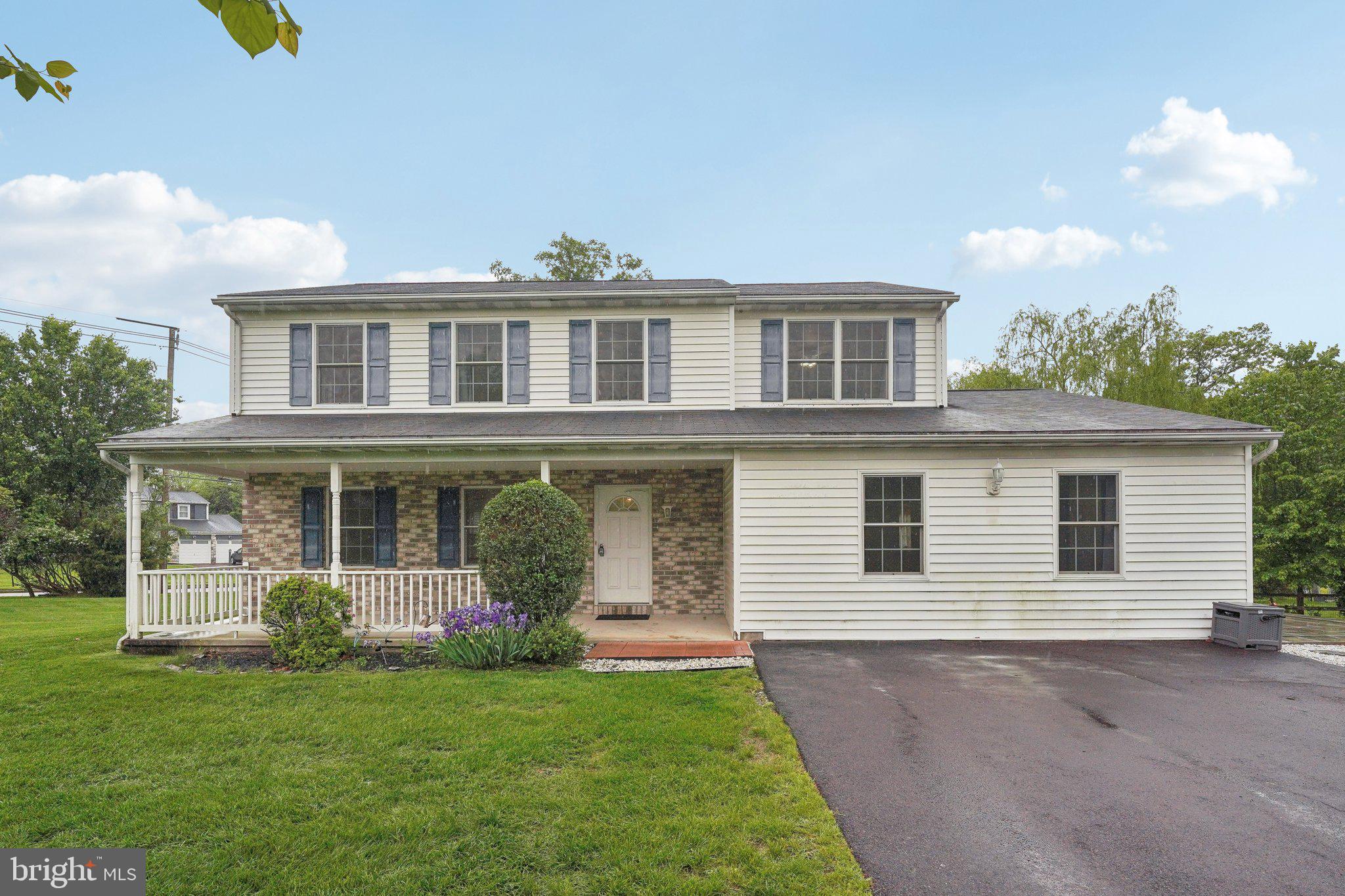 Welcome home to this 5 bedroom, 3.5 bath house proudly situated on a nearly ¾ of an acre corner lot. An inviting front porch invites you into the home’s entry. As you enter you are greeted by beautiful hardwood floors run throughout the large living room and dining area. The open concept kitchen features a breakfast bar, refrigerator and dishwasher new in 2023 and a large walk-in pantry for all your kitchen storage needs. Sliders from the kitchen lead out to the backyard and the new hardscape patio located to the side of the home. There is also a huge bedroom with a full, handicap accessible bathroom and separate entrance on the main level that would be ideal for a home office, in-law suite, playroom or whatever fits your needs. A laundry room and powder room complete the first floor. The second floor has a hall bath and four spacious bedrooms, including a large primary bedroom with full bath and walk-in closet. The next largest bedroom boasts two closets. A full, waterproofed basement with high ceilings provides an outstanding opportunity for additional finished square footage. A large driveway offers parking for up to six cars and the large side yard has plenty of space to build a large garage. This home benefits from the walkability of the neighboring Highley road community without the hassle of an HOA with a location nestled between Valley Forge State Park and Evansburg State Park - and in close proximity to grocery stores, restaurants, community library and the local middle school.