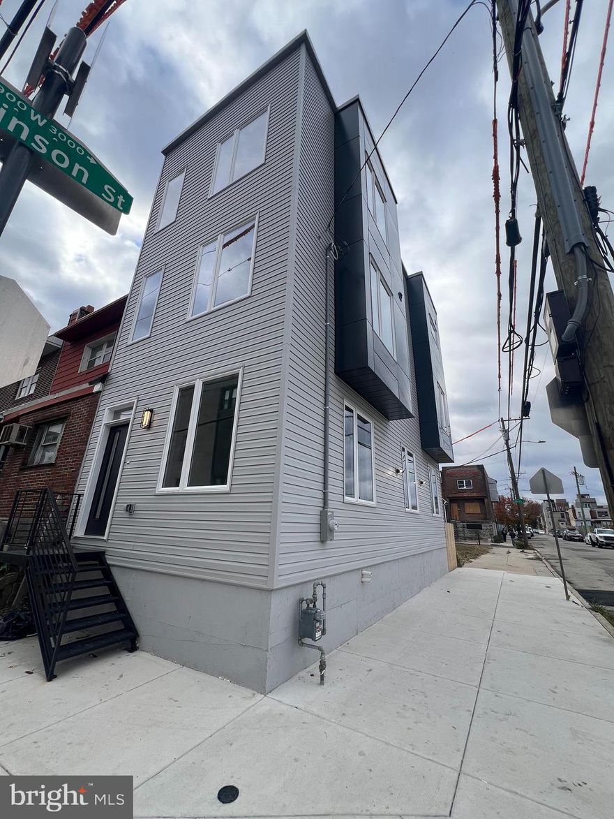 A TOP NOTCHED STUNNINGLY FINISHED CORNER NEW CONSTRUCTION.  Welcome to your dream home on the 30th block of 15th Street, one of the most desirable and easily accessible spots in Grays Ferry. This stunning new corner property checks every box with over 2,600 sq. ft. of living space, 4 spacious bedrooms, and 3 full baths. From the moment you step inside, you’ll be wowed by the modern finishes, gourmet kitchen, high-end appliances, private roof deck, and a luxurious master suite. Even better – it comes with a 1-year builder’s warranty  and 10 Years Tax Abatement is in process  for peace of mind.
The location is unbeatable! With a Walk Score of 93, daily errands are a breeze – cafes, restaurants, fresh markets, shopping, and parks are all just steps away. Main transit lines and easy highway access mean you can get anywhere in the city without the hassle, and you’re only 10 minutes from University City and UPenn, making it a perfect fit for professionals, students, or anyone who wants convenience at their doorstep.
Outdoor lovers will also enjoy being so close to Grays Ferry Crescent Trail, featuring 12 acres of open green space, meadows, fishing spots, and even a skate park – an amazing oasis right in the city. Spacious. Modern. Perfectly located. This home has everything you need and more – all that’s left is for you to move in!