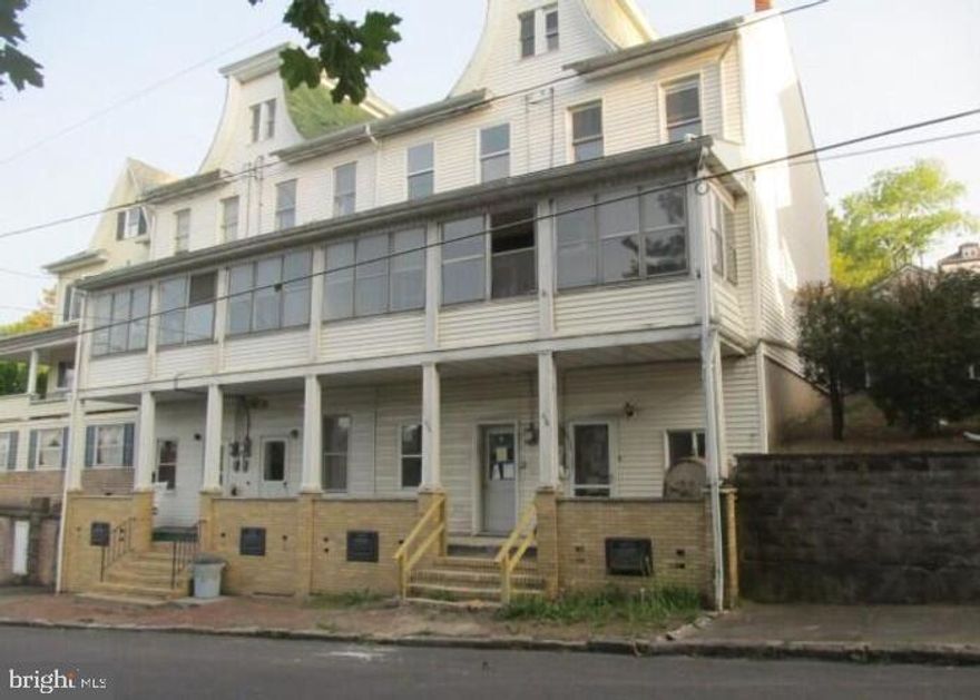 Built in 1900, this attached single family home offers three floors with approximately 1764 finished square feet, four bedrooms and one full bath, unfinished basement and covered front and rear porches. This home sits on an approximate 5450 sqft lot. This home was converted to a single family with renovation started but not finished. Upper level may be unsafe needing ceilings and flooring.