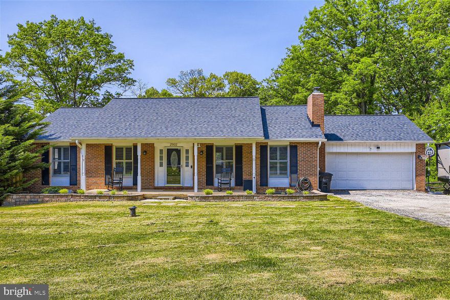 Beautifully maintained 4BR/2BA brick Rancher on a sprawling lot in Finksburg.  Pull into the double wide driveway and make your way to the covered front porch of your forever home.  Step into an open concept main floor offering tons of natural light and hardwood floors throughout.  The open living room boasts a wood burning stove surrounded by a brick hearth and wood mantle. Open lines of sight from the living room into the amazing kitchen and dining area makes this the ideal space for hosting family and friends.  The kitchen boasts plenty of wood cabinets, stainless steel appliances, granite countertops with a subway tile backsplash, a large farm sink under a window, and in the large dining area is a wall of cabinets with glass doors. This floor offers a spacious primary bedroom with a private bath featuring a walk-in shower, two sizable secondary bedrooms, and a full bath.  The lower level is finished offering additional living space that includes the fourth bedroom, a large family room, office space, a bar area, laundry, and a walk-out to an amazing yard. Sliding doors in the kitchen open onto an oversized raised deck that overlooks the fenced yard filled with tons of green space, offering adult shade trees, fruit trees, a fire pit, a covered patio, and a shed.  This home is move-in ready with so much to offer new homeowners.  Imagine all this and in close proximity to shopping, restaurants, and commuter routes.