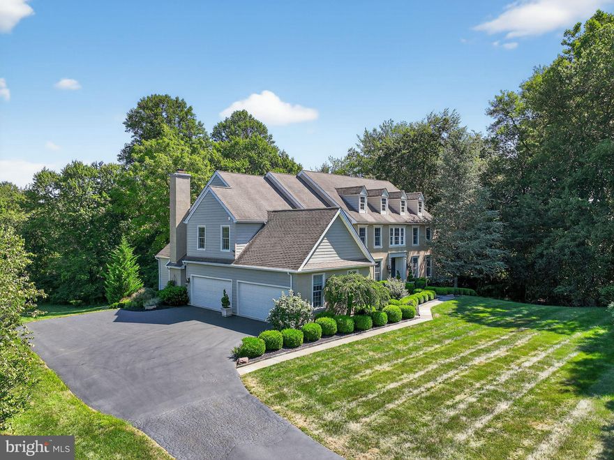 Stucco replaced with Hardie Plank siding. Full remediation completed in 2016! Welcome to 1716 Chantilly Lane, a 7000+ sq. ft. dream home, delivering the privacy and presence you’ve been searching for.  Nestled among the rolling hills of Chester Springs in the highly coveted community of Chantilly Farm—an enclave of just 34 luxurious custom homes—this gorgeous home combines elegance, comfort, and tranquility on nearly two private acres of professionally landscaped grounds. Enter through stately double doors into a soaring foyer with a sweeping staircase, setting the tone for the sophisticated design that unfolds throughout this beautiful home. The main level features an elegant formal living room and a spacious dining room, perfect for holiday gatherings and celebrations. The large gourmet kitchen is a chef’s delight, boasting a massive quartz center island, custom cabinetry, and premium appliances. The kitchen opens to a sunlit morning room with a vaulted ceiling and a cosy family room anchored by a floor-to-ceiling brick fireplace and dramatic windows. Sliding doors lead from the kitchen to an expansive deck made for dining, lounging, and laughter-filled gatherings with gorgeous sweeping backyard views. The main level also includes a handsome study, or library if you prefer, a stylish powder room and a large mudroom. Take the grand main foyer staircase upstairs to the primary suite, a luxurious retreat with walk-in closets and a spa-like bath featuring a soaking tub, oversized shower, and dual vanities. A princess suite with its own bathroom, two additional bedrooms with a Jack and Jill bathroom, a 5th bedroom and a large laundry room, complete the upper floor. The fully finished walk-out basement is an entertainer’s dream, showcasing a custom bar with built in appliances, a spacious lounge area, perfect for cheering on the Eagles and the Phillies and loads of space for games or recreation. A 6th bedroom, full bath, and a second laundry makes this level ideal for in-laws, an au pair, or long-term guests. An additional finished room offers flexibility as a gym, hobby room, or second study. Walk-out doors open to an extensive patio and multiple outdoor seating areas that invite you to sip wine, relax, and savor the beauty of this property. The home has 3 separate storage areas in the basement and a sizable 4 car garage, if you need more room for your sports equipment, bikes or canoes.  This entire home has undergone complete stucco remediation and James Hardie siding has been used on three sides of the house.  Set within the award-winning Downingtown East School District and nationally recognized STEM Academy, and with proximity to the Montgomery School, major routes (PA Turnpike, Rt 30, Rt 202), fine dining, shopping, and all the charm of Chester County, this home delivers the perfect blend of luxury, comfort, and lifestyle. The beauty and privacy of this home has to be seen to be believed, so schedule your private tour of 1716 Chantilly Lane today.