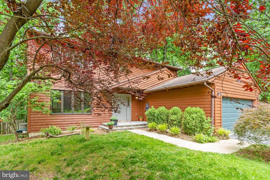 EXTENSIVE UPDATES - See list in MLS Documents for full list. Some highlights - wide plank red oak hardwoods, designer tile, new washer & dishwasher. Designer primary bathroom renovation. Numerous energy efficiency updates. Over one acre of pristine grounds which will be featured on a nature podcast and Instagram. Enjoy the vegetable garden, owner made forest trails, special order trees, wildflower meadow and chicken coop - a nature lovers dream! Garage can accommodate an electric car. Area for boat or trailer parking. With easy access to Route 50 and DTA, this updated woodland retreat is an escape to the country while being close to all of the Annapolis amenities you love.