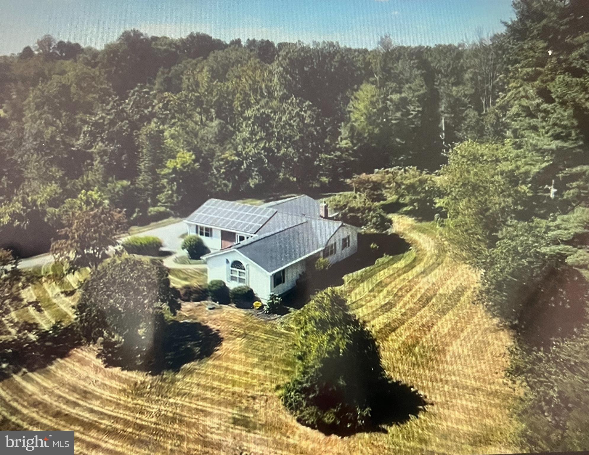 Beautiful Stately Rancher sitting on a gorgeous 3.46 acre lot backing to trees in a picturesque setting! Amazing large gourmet kitchen with all high end appliances which include a sub-zero refrigerator and Viking stove enhanced with custom solid wood maple cabinetry. Andersen windows & doors throughout! Adjoining great room and a new wood burning fireplace with custom book/display shelves on both sides of fireplace that makes life easy. Large island with built-in table for eating with still enough room for a large kitchen table. Interior painted with classic Benjamin Moore colors. Sizable bedrooms with generous closets. Walk out those kitchen doors to your own piece of private paradise and enjoy the peaceful setting with a vista at the top of the hill! Septic system 1 year old!
Oversized primary bedroom addition in 2005 with soaring ceilings and a palladian window, large walk-in closet and beautiful en-suite with marble heated flooring, a soaking tub and separate shower with double vanity.
Meticulously maintained hardwood flooring throughout. The 5-bay built-in tandem garage with a pit is a mechanics dream! Geothermal & Solar heating/cooling system with 18-20 hour backup if power goes out, that also provides most of the hot water. Brand new 50 year architectural shingle roof. Solar Panels Paid in full.
All of this in a great proximity to shopping and dining. For the outdoor enthusiasts, there is Loch Raven Reservoir for hiking, boating rentals and picnics! TRULY A NATURE LOVER'S RETREAT!