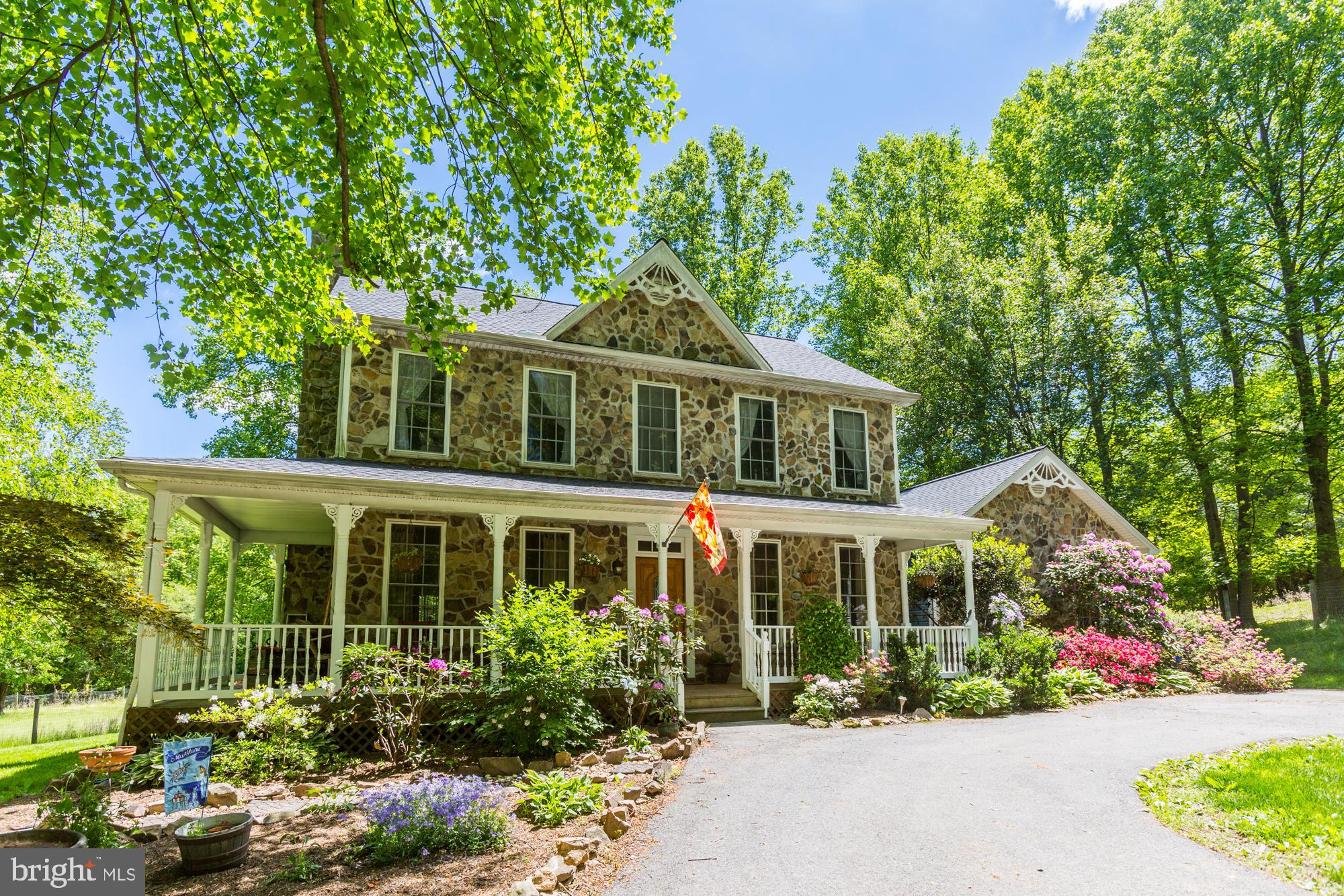 Amazing farmette in the heart of Highland! Want the country feel while not being too far from shopping, major commuter routes, restaurants, and everything else! If so, you've found your new home!! Starting with the interior, this home boasts many upgrades: stainless steel appliances, granite countertops, gleaming hardwoods throughout, walls of windows with tons of natural light, fully finished (and beautifully done) basement, an in-law suite on the first level, and wait until you see the enclosed patio!!! The pictures speak for themselves!! The exterior is equally as impressive. Tons of space for animals with a shed and barn! Beautiful pastures and one of the most serene settings in town! Solar panels too! Make an appointment today!!