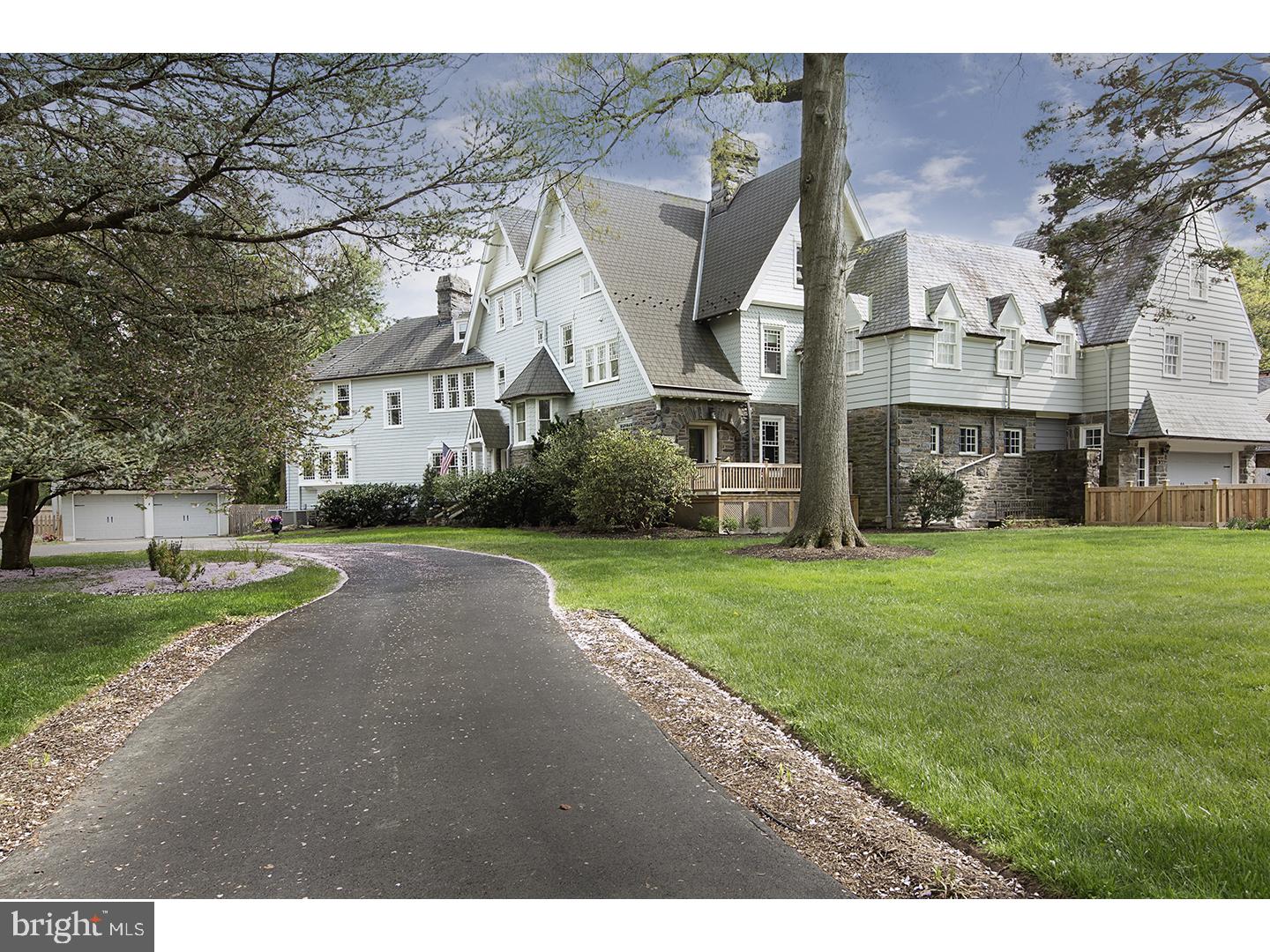 Sophisticated modern renovation of a classic Wyndmoor estate 540 East Gravers Lane. Theophilus Chandler Jr.,the founder of the UPENN Department of Architecture, designed 540 E Gravers Lane as a summer residence for the Paul family. Prime walkable location, only minutes to downtown Chestnut Hill and three blocks to Gravers Lane Train Station, this 6 bedroom, 5 full bath/2 half bath estate is truly one of a kind. The current owner's renovations have both maintained the historical integrity of the home and modernized this elegant estate. Constructed with Chestnut Hill Stone, this home boasts 6,380 square feet with two separate two- car garages set on a .78 acre lot. Additional living space can be found in the attached apartment with private entrance with separate systems perfect for a rental or in-law suite. Every detail of the home has been carefully thought out including historically accurate replacement windows, seven fireplaces, custom lighting, and a state of the art home/security automation system. The natural flow of the interior and exterior space are ideal for today's living. The first floor layout is an entertainer's dream. The living room, dining room, and billiards room with wet bar all open out to the lavish bluestone patio and lush grounds. Continue the fun outdoors with extensive exterior architectural and plant lighting, pergola, and roughed in plumbing for a future outdoor kitchen. The sun drenched chic breakfast room will win you over with its natural beauty and simplicity. The open concept kitchen is crisp and clean. For the chef, a 60" Wolf range with 6 burners, side by side 48" Sub Zero refrigerator/freezer, second prep sink with on demand hot water, honed marble island, and a new wine refrigerator awaits. The organic raised bed vegetable garden is ready for your green thumb. The kitchen opens to a sunken great room featuring a fireplace, coffered ceiling,custom built-in cabinets, and French doors leading to the second patio. The private home office allows for flexibility to work from home. Luxurious master suite with vaulted ceiling and skylights showcases a fireplace, walk in closet, and tranquil bath. Retreat to the distinguished library or grab a book on your way to the sunporch. The second floor also has three additional bedrooms, hall bath, and ensuite bath with dual vanities. The third floor boasts three additional bedrooms and two full hall baths. No detail missed with Full basement waterproofing 4 Zone HVAC.
