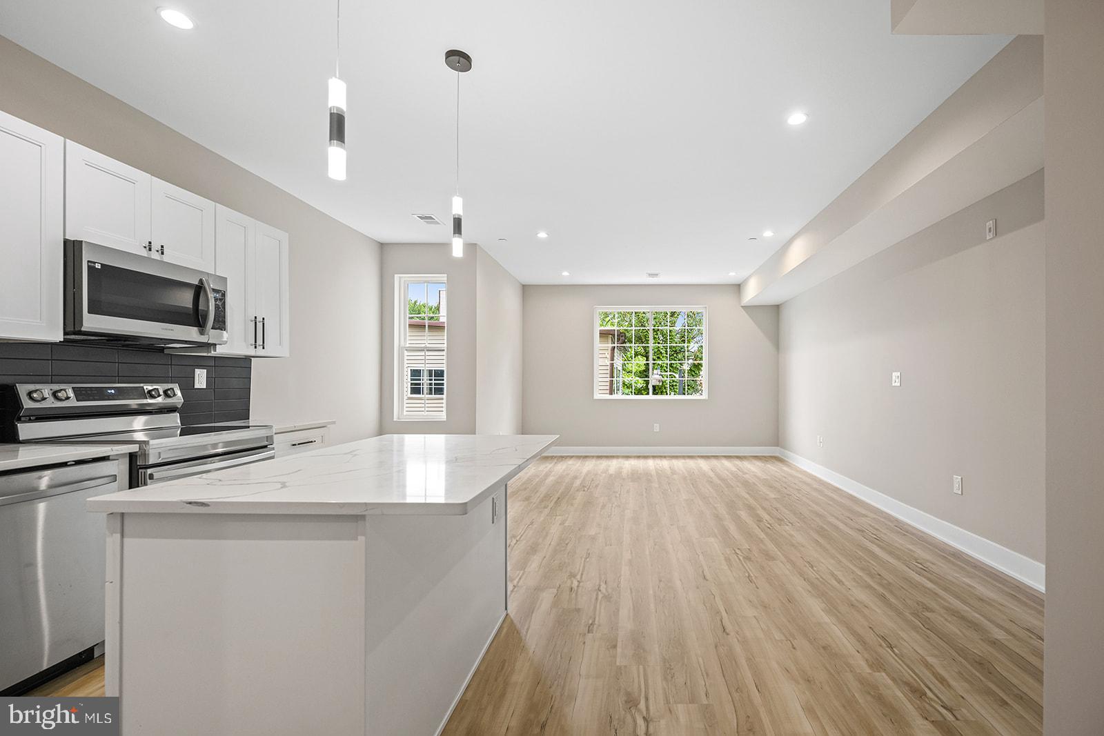 Located on the corner of Norris Square Park is this very large bi-level 2 bedroom 2.5 bath apartment with a HUGE private roof deck. This Luxury apartment is located on the 2nd and 3rd floor, on the main living space has it offers a 1/2 bath, closet/pantry, laundry room and very large living/dining room with a generous sized gourmet kitchen with stunning quartz countertops that includes a kitchen island for additional barstool seating. The upper floor has two sizable bedrooms each with their own en-suite full baths and large closets. You will enjoy the massive private roof deck in the evenings or for outdoor dining. Norris Square Park is a huge public park that has just been recently renovated with large trees and walkways, it is only 2 blocks from Fishtown, and Front Street where all your favorite restaurants and cafes are located including a block to Rowhouse Coffee, and just a few blocks to Starbolt, Picnic, Riverwards Produce, Sacred Vice Brewing and many more. You are also a close commute to the Dauphin Street Subway stop and Temple University. Easy application process, small pets ok with $300-$500 non-refundable pet fee, and tenant pays $75 flat fee for water and utilities paid separately.