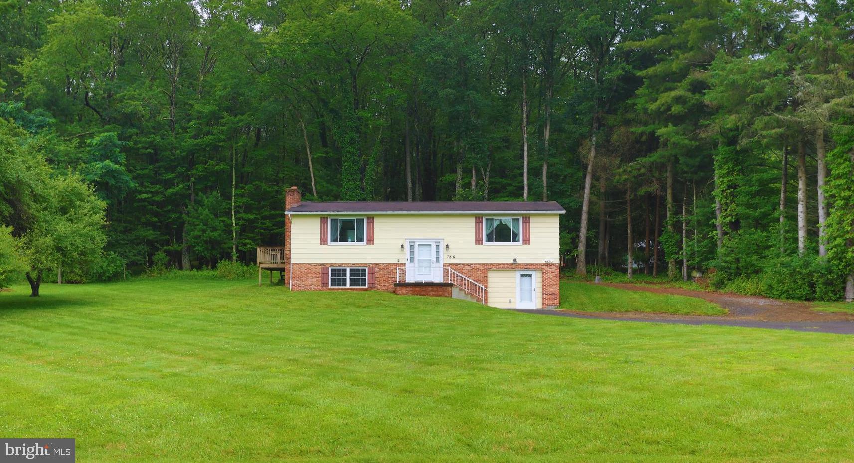 Location matters! Just 1 mile from Wisp ski area. Look no further for your second home and/or investment property. 2 level, 3 BR very well-maintained split foyer home .85-acre level lot, just mins from the slopes & lake! Main level has living area, kitchen/dinning, 2 BR with full bath. Lower level has sleeping area, family room, 1/2 bath and an additional walk out living area with wood burning stove. Comfortably sleeps 10 people. 3 Split-level air-conditioning units are through the home. Stackable washer/dryer in basement utility room, plus walk in cedar closet for extra storage. Additional lot was purchased in the back, also included with purchase. Good bones and ready to move in! Close to restaurants, shops, lake & slopes, yet a private setting with NO HOA!