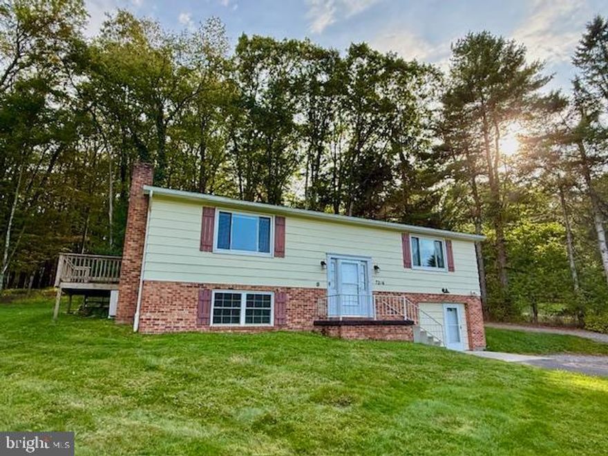 Location matters! Just 1 mile from Wisp ski area.  Look no further for your second home and/or investment property.   2 level, 3 BR very well-maintained split foyer home .85-acre level lot, just mins from the slopes & lake!  Main level has living area, kitchen/dinning, 2 BR with full bath.   Lower level has sleeping area, family room, 1/2 bath and an additional walk out living area with wood burning stove. Comfortably sleeps 10 people. 3 Split-level air-conditioning units are through the home.   Stackable washer/dryer in basement utility room, plus walk in cedar closet for extra storage.  Additional lot was purchased in the back, also included with purchase. Good bones and ready to move in! Close to restaurants, shops, lake & slopes, yet a private setting with NO HOA!