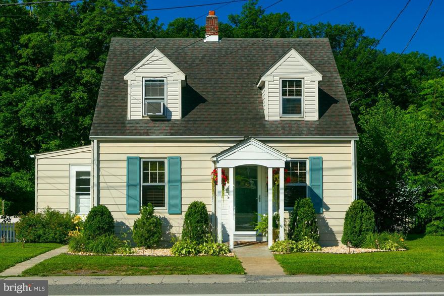 This charming Cape Cod is full of character and a must-see! Step inside to find hardwood floors, original trim, and a spacious layout filled with natural light. This well maintained two bedroom, two bathroom home offers a timeless curb appeal and cozy living. This is the perfect home if you're looking for charm and convenience, located right off Route 9 and walking distance from basketball court, tennis court, and volleyball just beyond the backyard! The main floor features a spacious living room, a bright kitchen with vintage touches, and dining area great for entertaining. The unfinished basement has great storage and a new water treatment system as well as the second full bathroom. This location comes with many perks such as being near by the new bypass, park and natural springs, shopping, and schools.