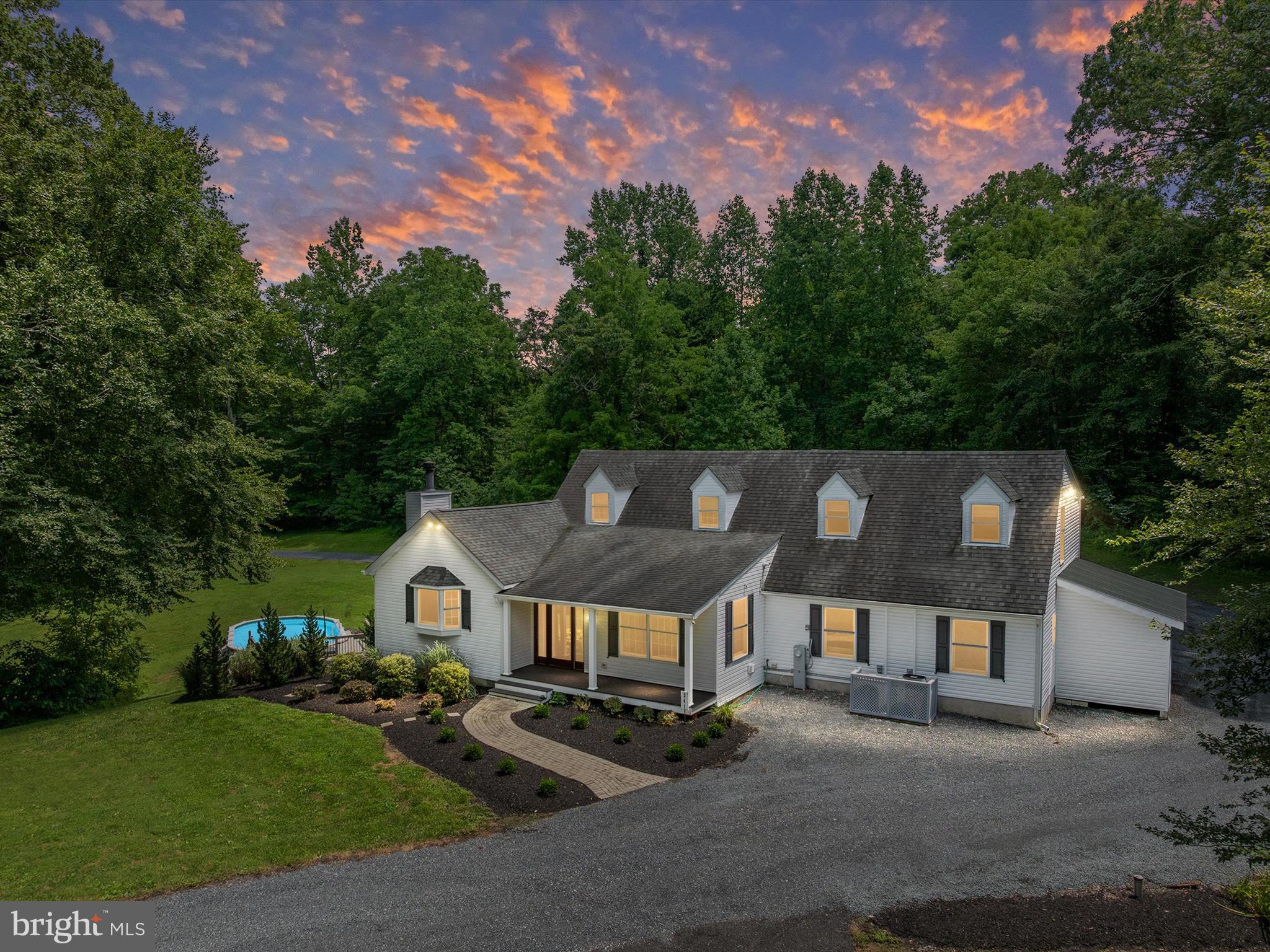 Move-in ready Cape Cod situated on 14.74 acres of privacy in Harwood, Maryland. This spacious home offers 6 bedrooms and 3 full bathrooms, including 2 main-level bedrooms with a full bath—ideal for guests, multi-generational living, or a home office setup. The great room features cathedral ceilings and offers an inviting space to relax or entertain. Upstairs, the large primary suite provides a peaceful retreat with a generously sized walk-in closet, an attached full bathroom, and a private balcony overlooking the beautiful property. The multi-level deck wraps perfectly around the pool—ready for summer fun and outdoor living.
Car enthusiasts, hobbyists, or those in need of additional storage will appreciate the detached 30’ x 40’ pole barn, perfect for heavy equipment, a workshop, or recreational vehicles.
Enjoy the perfect balance of seclusion and convenience with this unique property. A rare opportunity to own a private retreat with endless possibilities!