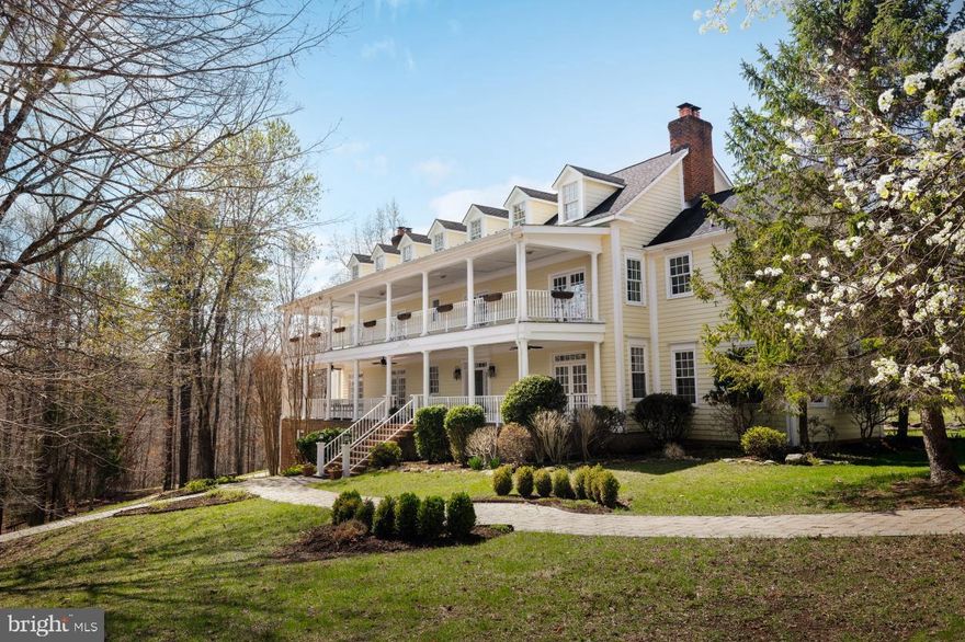 *Seller financing may be available to qualified Buyers.* 
Experience the charm of 'Bricquebec', a beautiful and unique custom-built home on 14.67 private acres with flowing stream, gorgeous pond and extensive walking trails. This Home has undergone a recent interior transformation (including professional staging) to show its true value.  The entire structure is reminiscent of a historic Charleston Colonial.  Bricquebec was imagined and built as "wood by the stream" by its present Owner- down to the extensive molding, built-in cabinets and stunning wood staircase. Come and enjoy the thoughtfulness that has gone into this beautiful southern-style home.

Bricquebec is large in size,  yet, personal, extremely livable and unassumingly formal. Entertaining is a delight in the custom-kitchen with large eat-in area, double ovens, formal dining, sunroom, beautiful living area and piano room with shared fireplace. Enjoy the privacy and seclusion of a main-level office and library with adjoining fireplace and abundant built-ins for your favorite books and accent pieces!

Upstairs, you'll find 4 lavish bedrooms- each with ensuite baths. The primary and guest suites include large, luxurious baths and fireplaces. The Upper floor (completed in 2017) offers generous flexible-space inclusive of optional 5th bedroom/bath, kids play area, teen-hangout, a gym/workout space, office or yoga room- this bountiful space is ready to meet your needs and imagination.

Lower-level basement offers finished and unfinished work space- perfect for hobbies, workshop, storage, plus substantial utility room.  Home has been well-maintained with meaningful upgrades including: new roof, paved driveway, gas furnaces, skylights, hot water/pressure tanks, H2O filtration system and Back-up Generator (all within the last few years). Amuse yourself in the 45'x25' garage space (large enough for your favorite Horse and Wine Country hobbies). Sports Court, Greenhouse and picturesque Stonewalls convey! Be one with nature alongside the pond, brisk running stream and substantial nature trails.

Seller financing may be available for qualified buyers-Inquire through Listing Agent.