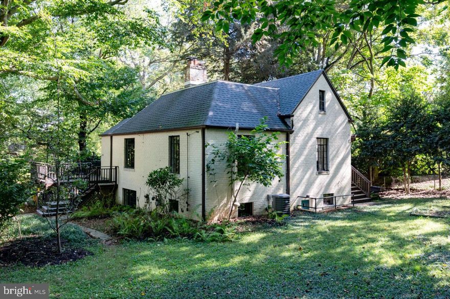 Welcome to 7504 Jackson Avenue in Takoma Park, Maryland: a beautifully curated Cape Cod with one of the city’s best screened porches.  This home sits on a lovingly maintained 1/3-acre lot, less than a block from Sligo Creek and its walking and bike paths, with easy access to public transportation and all Takoma Park has to offer!  

An energy-efficient Takoma Park-certified “green” home, 7504 Jackson’s features include a newer roof, updated kitchen, skylights, and an amazing screened in porch. You'll even get a chicken coop for your own private flock.  Sitting within an enviable canopy of local trees and foliage, the house offers both privacy and refuge from the busy-ness of the day-to-day!

With the gorgeous screened-in porch to the left of the front door and a welcoming deck to the right, proceed into a welcoming entryway with plenty of space to unload the burdens of the day before proceeding into the living room, complete with a working fireplace and built-in bookshelves.  To the left is the updated kitchen and dining area, and access to the porch, perfect for three-season entertaining.  Past the living room you’ll find two bedrooms, and a bathroom.   Behind another door are the stairs to the skylit upstairs, perfect for a playroom, bedroom or study; also upstairs is another bedroom, half-bath, and ample storage space.  

The lower level provides a large and welcoming family room with another working fireplace, more built-in bookshelves, and more large, picturesque restored metal casement windows which provide a surprising amount of natural light. This level also includes another bedroom and bathroom, as well as a laundry area, a workshop, and a separate entrance.  To the right of the house is a long driveway with easy capacity for 3-4 vehicles.  Beyond the driveway you’ll find a huge and cared-for outdoor space, including the chicken coop, sitting high above the terraced yard.  

All in all, it’s hard to imagine a more perfect blend of Takoma Park nature and serenity alongside all the community and convenience the city has to offer.  This home is just a short distance from local schools, parks, shopping, and dining. With easy access to public transportation, commuting to Washington, D.C., and surrounding areas is a breeze.  Experience the best of Takoma Park living at 7504 Jackson Avenue. Schedule your private tour today and envision the possibilities of making this charming house your new home!