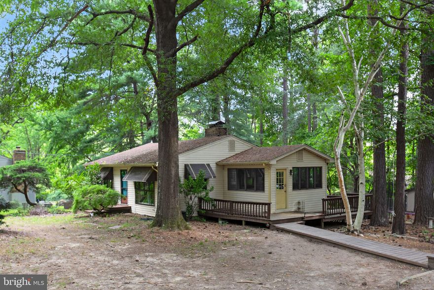 Charming Coastal Retreat in Driftwood Beach Community – 141 Poland St, Montross, VA 22520

Looking for peaceful living near the water? This 2-bedroom, 1-bathroom single-story home, built in 1976, offers 1,008 sq ft of cozy comfort with classic charm and unique outdoor spaces — all on a spacious 0.5-acre lot in Westmoreland County.

Inside, you'll love the wood-burning brick fireplace, original wood floors, and sunroom that floods the space with natural light. Step outside to find a screened-in porch, multiple decks, and a very large back patio — perfect for entertaining or relaxing in the serene setting.

One of the standout features is the large detached garage, ideal for multiple vehicles, lawn equipment, a workshop, or extra storage space. The upstairs unit in the garage offers potential for an additional bedroom, guest suite, or home office. A large driveway provides ample parking for guests, boats, or trailers.

Located in the sought-after Driftwood Beach Community, you're just steps from the private community beach and boat ramp — making water access quick and easy. Spend your weekends exploring the Potomac River, cruising up to Washington D.C. or down to the Chesapeake Bay and make your way to Newport News.

Only minutes from Westmoreland State Park, and less than 40 minutes to Tappahannock, this location is a perfect mix of nature, recreation, and convenience.

If you’ve been dreaming of life by the water, this is your chance to make it a reality!