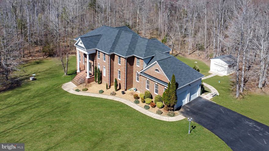 Elegant Custom Estate in Christy Farm, Over 4 Private Acres of Secluded Living

Welcome to this stunning custom-built home nestled in the highly desirable Christy Farm subdivision of Stafford, Virginia. Set back on 4.16 private, wooded acres with a long, tree-lined driveway, this 5,882 sq. ft. home offers the perfect blend of luxury, privacy, and thoughtful design, all meticulously maintained by its original owner.

Inside, you’ll find  hardwood floors throughout the main living spaces and bamboo flooring in the fully finished basement. The gourmet kitchen is a true centerpiece, featuring premium quartz countertops, a striking waterfall island, and a matching full-height quartz backsplash ideal for cooking, gathering, and entertaining in style.

The owner’s suite is a true retreat, anchored by a spa like bathroom with an oversized 8' x 5' walk-in shower, multiple shower heads including a rain feature, and serene 24x48-inch porcelain tile throughout. Dual vanities provide personal space and comfort, while neutral tones create a calming, spa-inspired atmosphere.

Additional features include a beautiful brick-front exterior, a two-car garage, and the quiet luxury of a secluded setting, just minutes from shops, restaurants, and commuter routes. Whether you're hosting loved ones or enjoying peaceful mornings on your private property, this home was designed for both connection and tranquility.

Don’t miss your chance to own this rare gem in Christy Farm—schedule your private showing today.