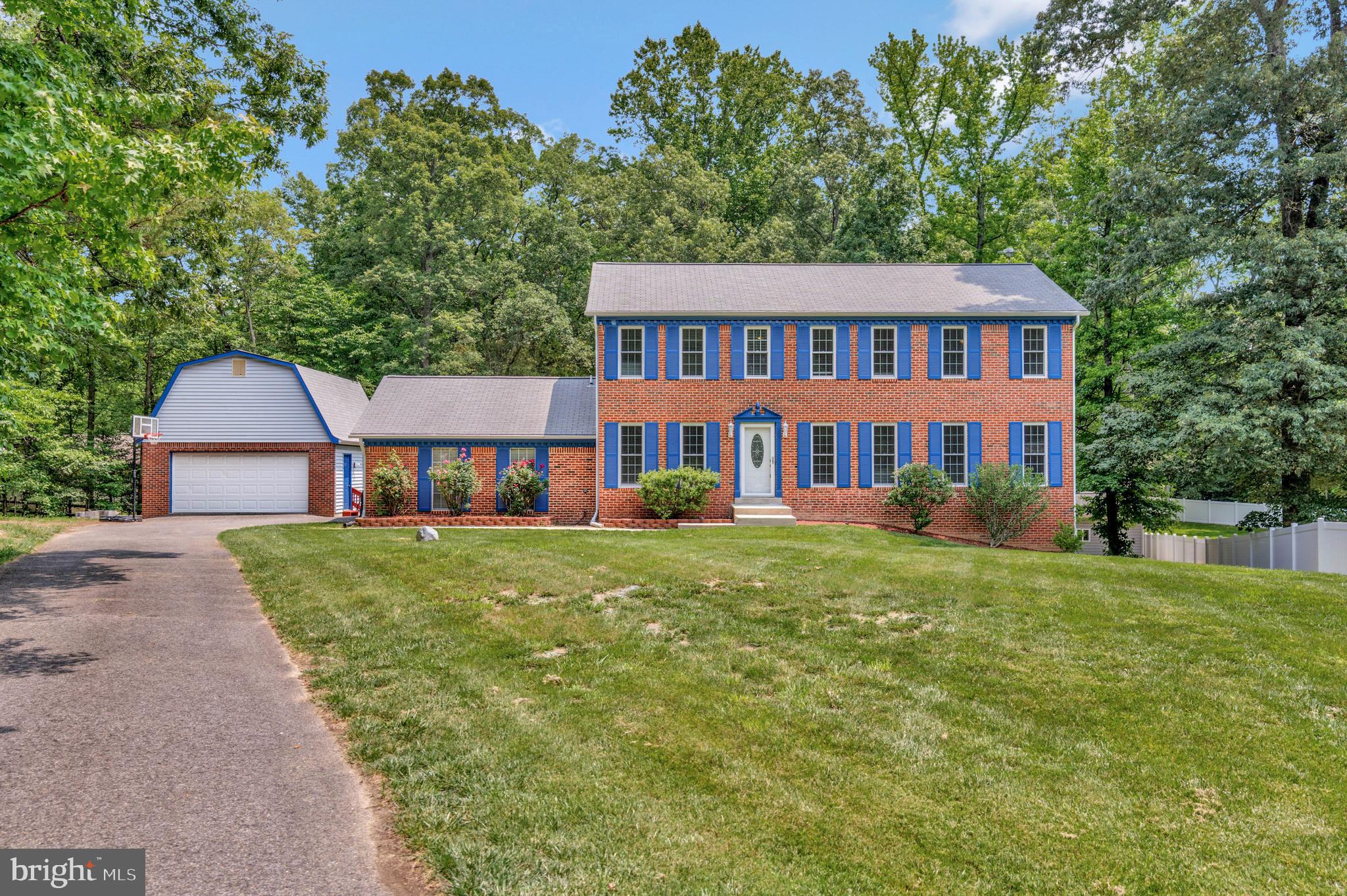 Back and Better than ever! Located in the Laurel Branch subdivision - NO HOA - This large brick colonial on a fully finished basement has a 2 car side load garage PLUS a matching, detached 2 car garage with loft/workshop! There is also a 15ft x 15ft shed which was converted to a recreational room or can easily be used for extra storage, it has a mini-split heat pump unit for year-round use. Kitchen updates were done within the last 3 years to include stainless steel appliances, granite counters and new water resistant flooring. Upper level has 4 BR and 2FB. Owner's suite has a WIC and a newly renovated full bathroom with ceramic tile shower enclosures. The basement is open and very spacious! It offers a bedroom and full bathroom. It's walkout level and easy access to the back yard and deck. The lot is .71 acres and is partially cleared and has a park like setting with mature trees that line the back and side of the property. Located at the end of a cul-de-sac there will be no thru-traffic. This is a FIND!
