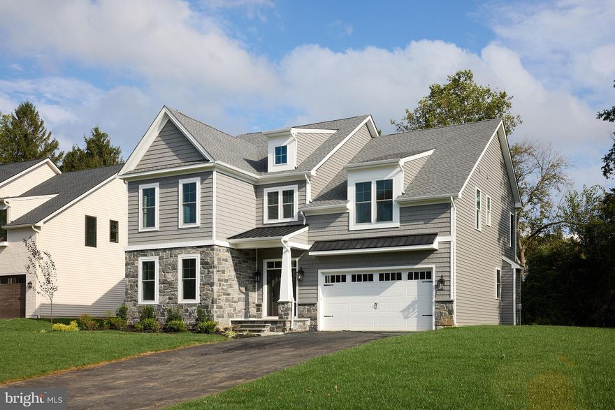 The Dartmouth at Glenway – A BeSpoke Custom Home by Award-Winning Foxlane Homes

The Dartmouth at Glenway embodies the artistry of Foxlane’s Custom BeSpoke Collection. Classic shake siding and Cheltenham stone create timeless curb appeal. The first floor offers a functional, welcoming layout with a designer kitchen featuring Calacatta Valentin quartz, GE Café appliances, and a walk-in pantry, an informal dining area, family room with slate-surround fireplace, study, powder room, and mudroom. Wide-plank white oak floors run throughout, providing a neutral, elegant foundation.

Upstairs, the primary suite is a spa-like retreat with Calacatta Idillio quartz, freestanding tub, and frameless glass shower. Three additional bedrooms and two full baths provide comfort for family and guests. The finished lower level adds 718 square feet of flexible living space, plus an additional powder room. Every detail is thoughtfully curated by the Foxlane Homes Design Studio, making this a BeSpoke home designed for a life well-lived.