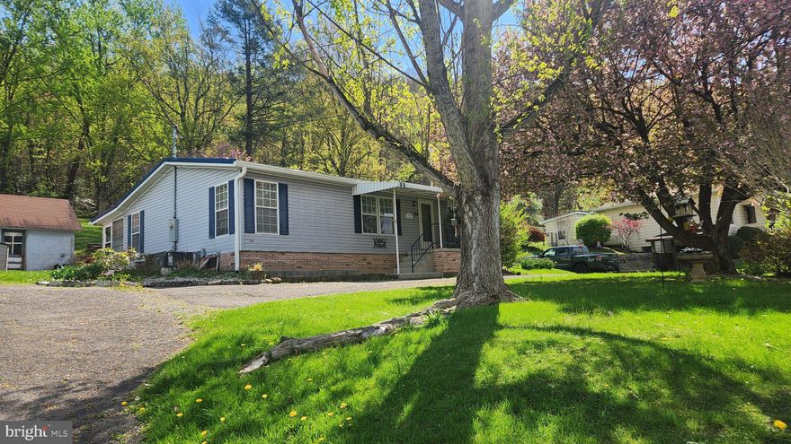 One owner, well maintained home.  Single floor living.  Paved driveway with one car detached garage.  Enclosed back porch.  Sunset views from the front of the house.  No city taxes but public utilities!  Short drive to city amenities.