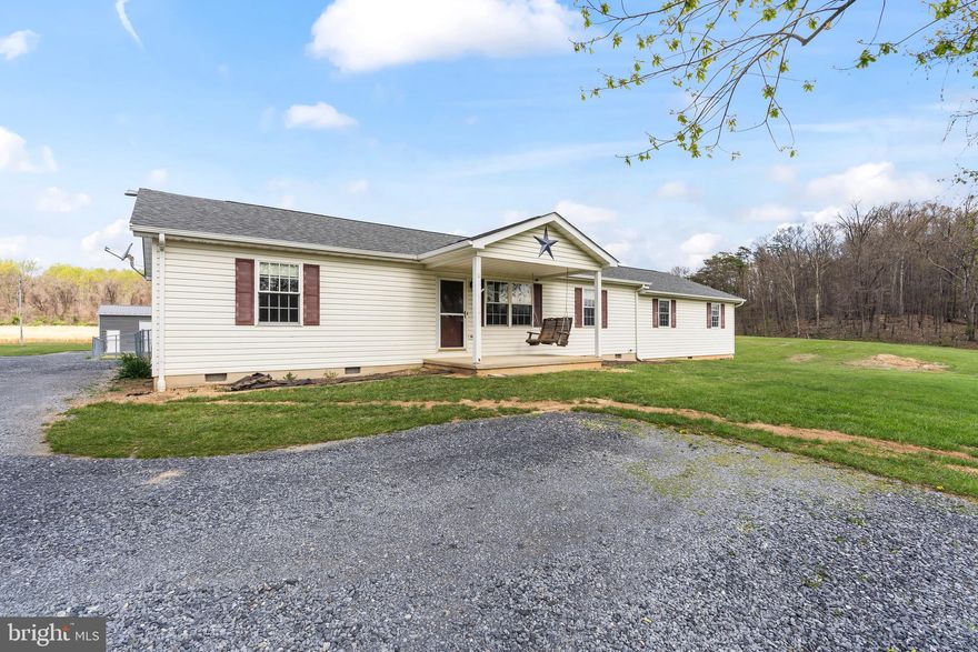 ** Final offers due 04/29/2025 by 9am**

Escape to the beauty and tranquility of the West Virginia countryside with this charming ranch-style home, offering main-level living on a stunning 4.57-acre unrestricted lot. Located in Hedgesville, this property is perfect for those seeking space, freedom, and the peace of rural living.

The home boasts a spacious and functional layout with three comfortable bedrooms + an additional smaller bedroom and two full bathrooms—ideal for families or anyone looking for single-level convenience. The welcoming interior flows easily from room to room, making everyday living feel effortless. These owners built on to make even more space with another large family room as well! In addition, they redid the entire roof of the home just a couple years ago! 

Need space for projects or storage? You’ll love the oversized detached 3-car garage, perfect for vehicles, equipment, or a workshop setup. This is practically new AND it comes with a lift! 

Outside, the scenic property truly shines. A serene pond—complete with fish, frogs, ducks, and geese—adds a peaceful, natural touch to the landscape. Whether you’re sipping coffee on the porch or watching wildlife by the water, it’s a slice of country paradise. You can overview the beauty and peace of this landscape from your stamped patio outside the home in the fenced in yard. 

With no restrictions, you have the freedom to live your way—bring your animals, expand your hobbies, or create the homestead of your dreams.

If you’re looking for privacy, open space, and beautiful surroundings, this one checks all the boxes. Come see it for yourself—schedule your showing today!