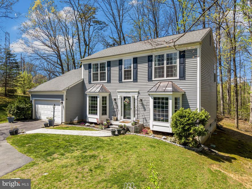 Welcome to this stunning and meticulously maintained 4-bedroom, 3.5-bath single-family home with a 2-car attached garage, ideally situated on a quiet cul-de-sac in the highly sought-after Twin Oaks Farm community of Woodbridge. This home offers peace of mind with a newer HVAC system (2021), sprinkler system (2020), and a new water heater (2023). Freshly painted throughout, it’s truly move-in ready and thoughtfully equipped with Blink security cameras that convey.

From the moment you step into the welcoming foyer, you’re greeted by sparkling hardwood floors that flow throughout the home and lead into elegant living spaces. The formal living and dining rooms feature large bay windows, crown molding, and chair rail, creating the perfect setting for both everyday living and entertaining. A main-level office provides an ideal work-from-home setup. The inviting family room, centered around a cozy gas fireplace, opens seamlessly to the gourmet kitchen—complete with quartz countertops, stainless steel appliances, gas cooking, a spacious island, and a bright breakfast nook. Step outside to the Trex deck, perfect for outdoor dining and relaxing in your private, tree-lined backyard that backs to peaceful green space—where you’ll often spot deer and an abundance of local wildlife.

Upstairs, the expansive primary suite impresses with vaulted ceilings, hardwood flooring, a sitting area, and a walk-in closet. The beautifully remodeled en-suite bath features double vanities, a soaking tub, and a separate shower. Generously sized secondary bedrooms offer vaulted ceilings, ceiling fans, and flexible space, while the updated hall bath adds convenience for busy mornings.

The fully finished lower level is designed for entertaining and versatility, featuring a recreation room with a custom wet bar and walk-up access to the backyard. Two additional bonus rooms offer endless possibilities—ideal for a 5th bedroom, home gym, office, or media room—along with a full bath and ample storage space.

Twin Oaks Farm residents enjoy community amenities including an outdoor pool, tot lot, basketball courts, and scenic walking trails. Located just minutes from shopping and dining at Potomac Mills and offering easy access to major commuter routes like Interstate 95, this home provides the perfect blend of comfort, convenience, and community living.