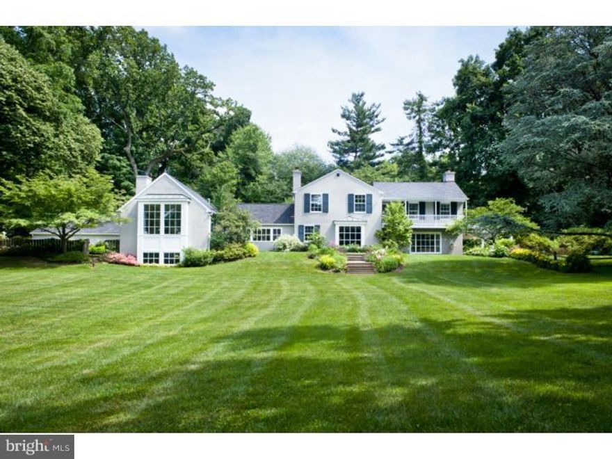 Set well back on a private lane and surrounded by magnificent old specimen trees and plantings that provide a park-like setting, this home is the epitome of charm, comfort, and convenience.  Near the center of the village of Bryn Mawr, this exceptional colonial style house is completely updated and customized.  It is in excellent, move-in condition with special features throughout and the mature grounds are impeccably planted and maintained.  Among the many special features are: A floor plan that flows from space- to-space with ease;  Extraordinary amounts of natural light flowing through oversize windows and French doors;  Hardwood floors in every area, including random width and length;  Multiple exits from house to private, stunning outdoor areas;  Impeccable maintenance of both grounds and house;  An elegant, custom designed and stained entry hall floor;  Tasteful and stylish choice of existing paint colors;  Generous interior millwork and architectural details including use of columns, beaded board, chair rails, crown moldings and built-in cabinetry with storage;  Updated, eat-in kitchen featuring new stainless steel appliances and granite countertops;  Updated double hung and working thermal pane windows are among the improvements.  The owners used top area builders / designers (E. B. Mahoney for family room and RC Legnini for kitchen) for renovations and additions.  This is an extraordinary property and opportunity for a discriminating buyer.  Room dimensions are estimates and are not guaranteed.
