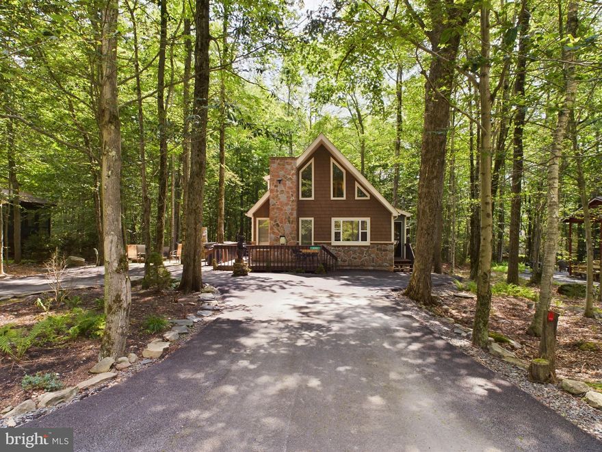 Two-story Chalet in the gated, amenity-filled community of Arrowhead Lake. This 4 bedroom, 2 bath home has a grand second floor master suite with it's own full bath and walk-in closet. The main floor features a foyer with coat closet, cathedral ceilings, propane fireplace with marble surround in the living room, updated kitchen with tile backsplash and breakfast bar, plus a full size washer/dryer off the kitchen. Enjoy the outdoor scenery from the deck and the privacy of lots of open space behind the house. Hot Tub and fire pit.  Walking distance to the heated Choctaw Pool!

Arrowhead Lake is a gated community with security, 3 heated swimming pools, 2 lakes for fishing/swimming and boating, tennis courts and bocce ball. Many of these activities have occurred over the years including bonfires, carnival, Zumba, water aerobics, swim team, potluck dinners/breakfast and summer camp.